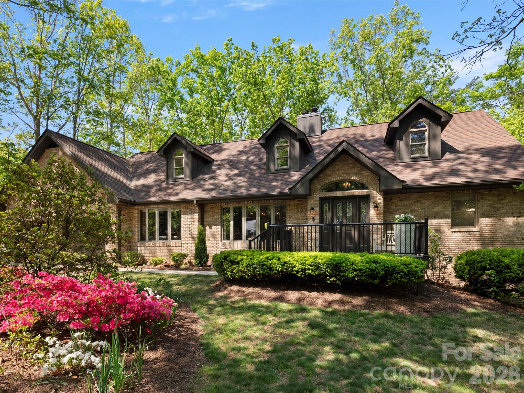 Full brick home full finished basement and walkout second living quarters. Cement board, brick, and 2 x 6 construction. Front porch expanded with commercial grade metal railing system and Trex. - 152 Eastmoor Drive, Asheville