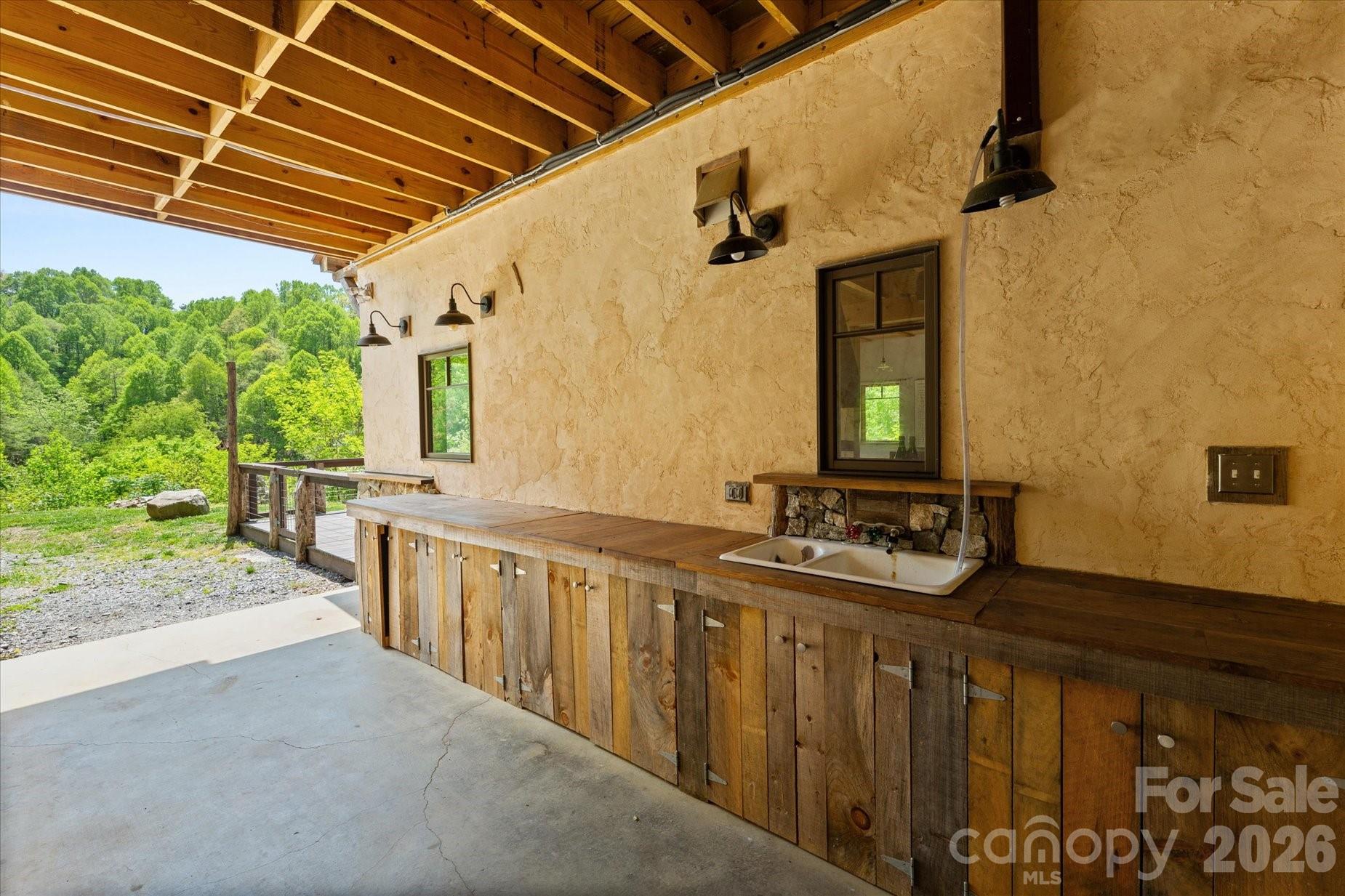 entrance with outdoor prep area and sink - 3151 Lumptown Road, Marshall