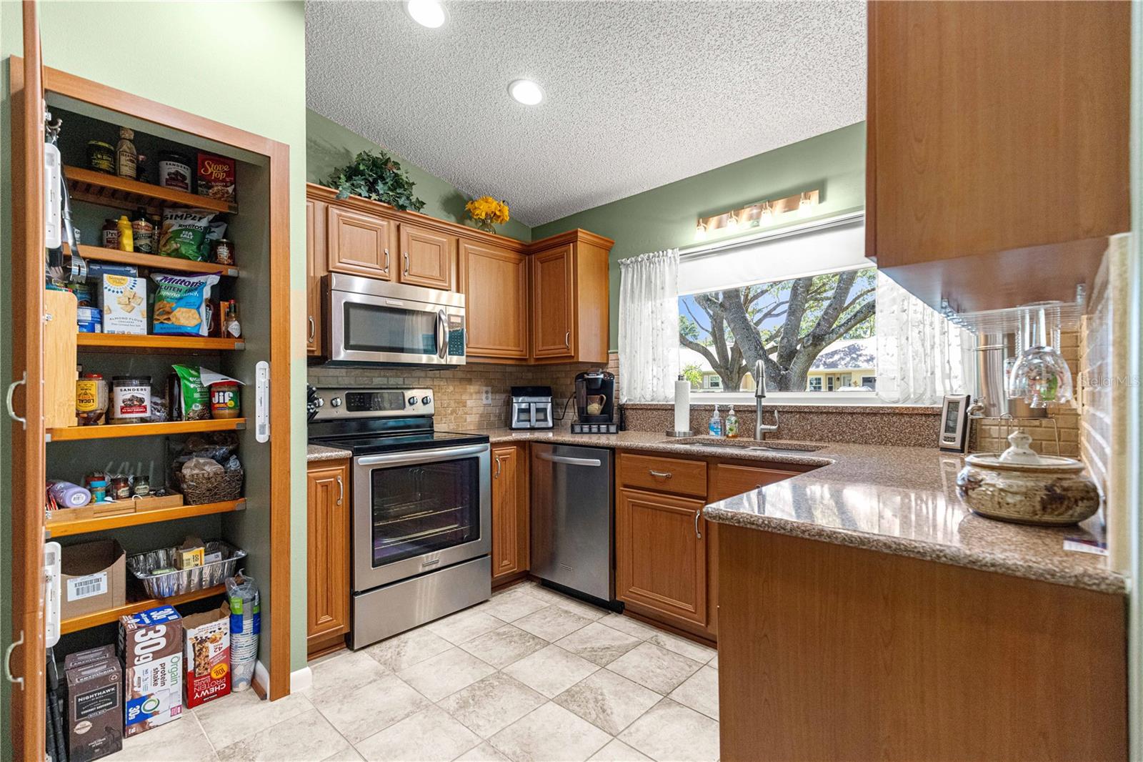 KITCHEN -  LARGE PANTRY WITH BUILT-IN SHELVES - 9380 SW 84TH TER #C, OCALA