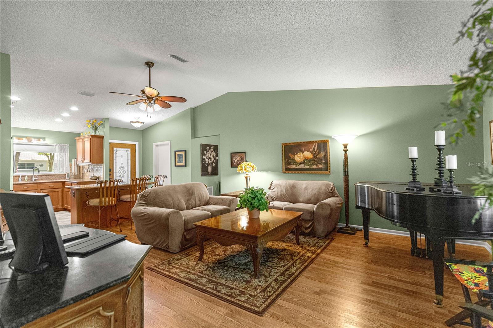 GREAT ROOM WITH VAULTED CEILINGS -     Piano -  Does Not Convey - - 9380 SW 84TH TER #C, OCALA
