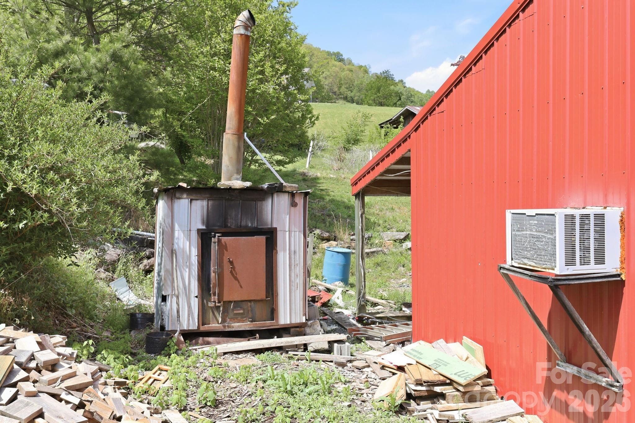 Outdoor wood boiler for workshop - 2225 Bald Creek Road, Clyde