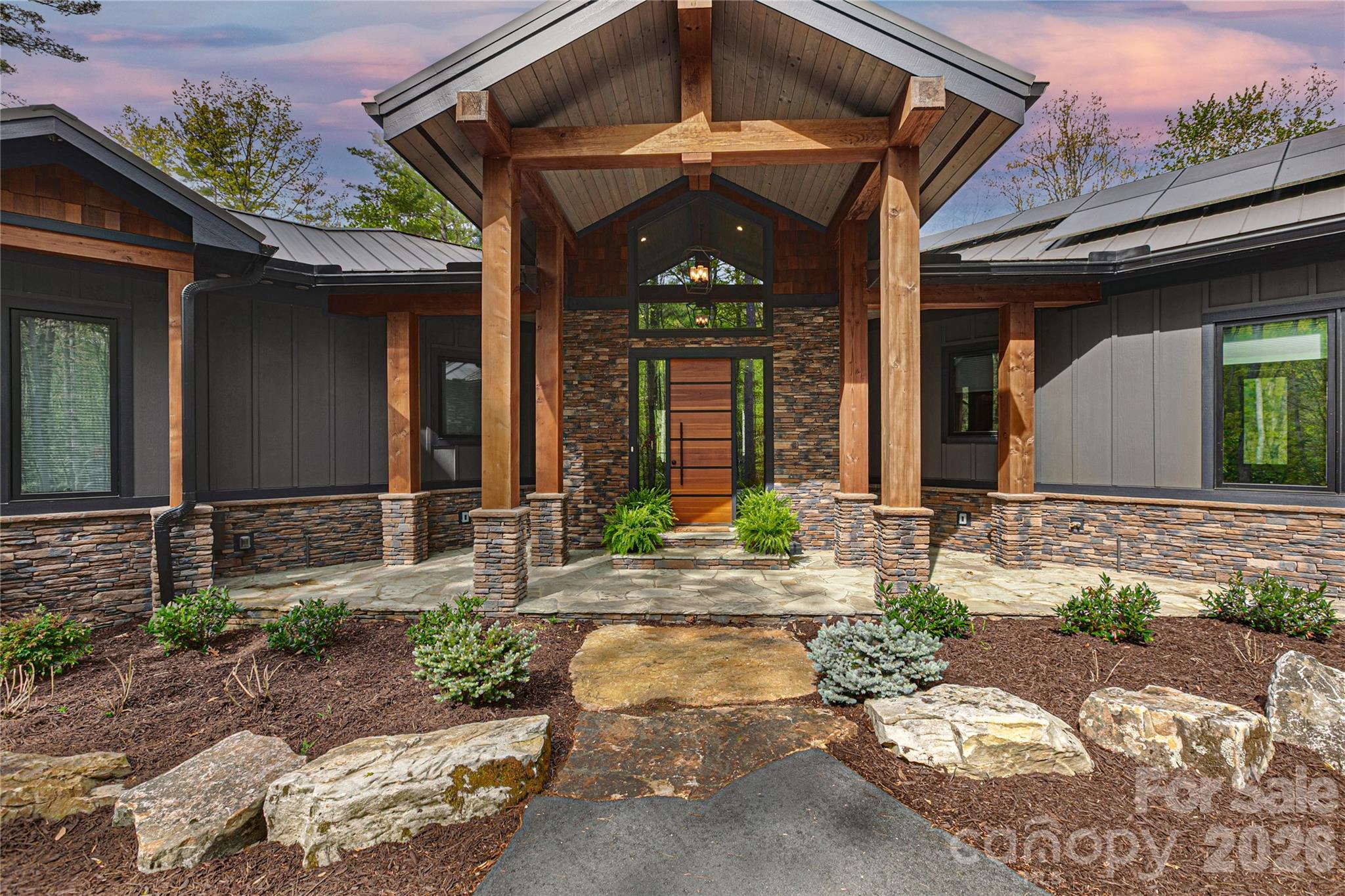 Inviting covered entryway with well-maintained landscaping. - 726 Ugugu Drive, Brevard