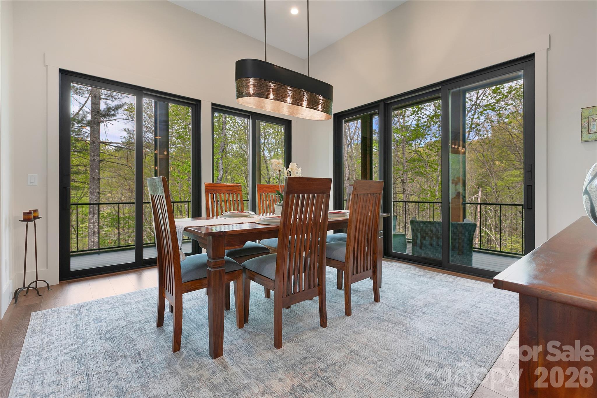 The dining room, designed with the intention of providing a welcoming and functional space perfect for hosting both entertaining gatherings with guests and cherished family get-togethers. - 726 Ugugu Drive, Brevard