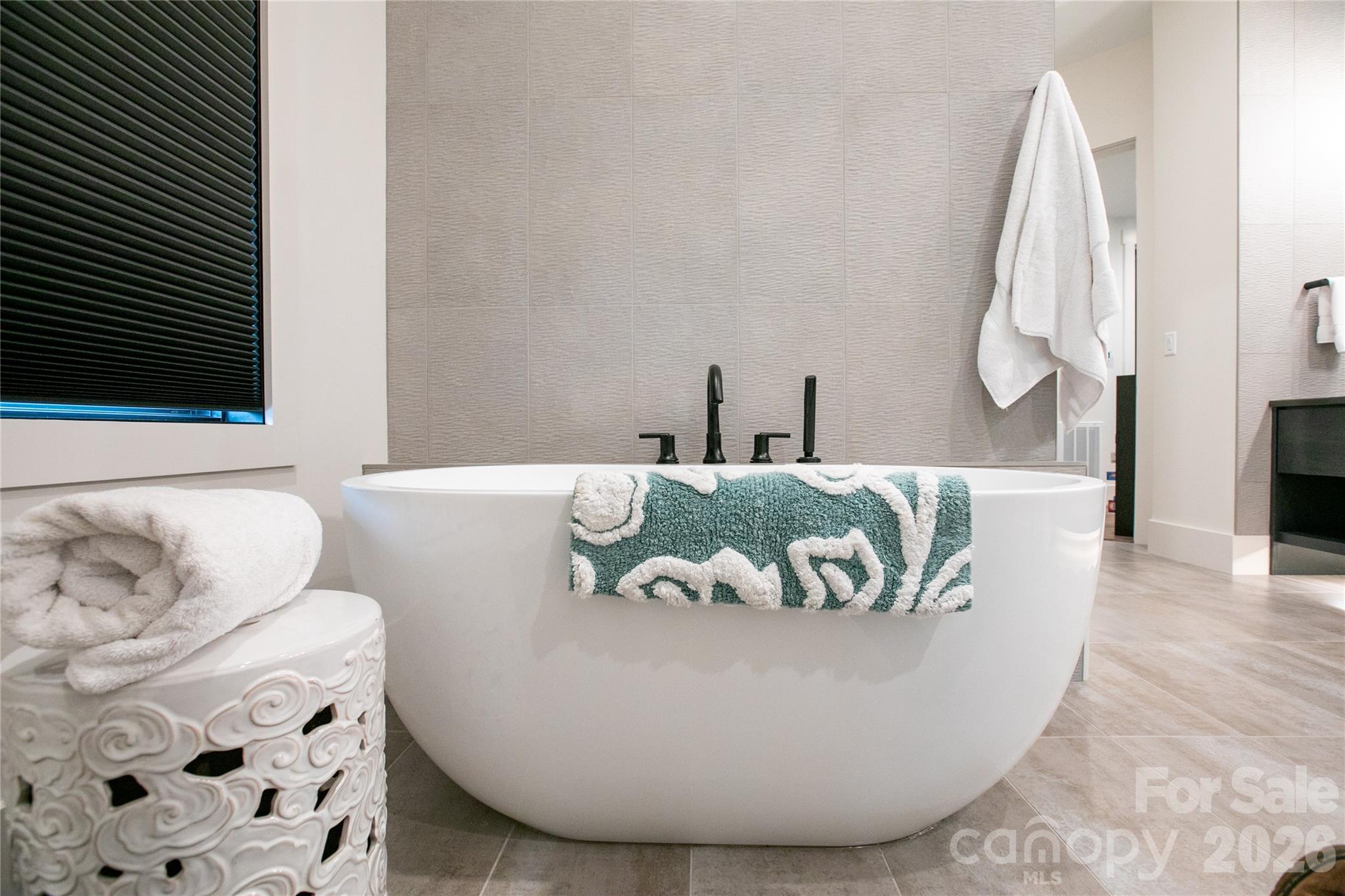 Relax and unwind in the soaking tub after a long day, creating a peaceful spa like retreat. - 726 Ugugu Drive, Brevard