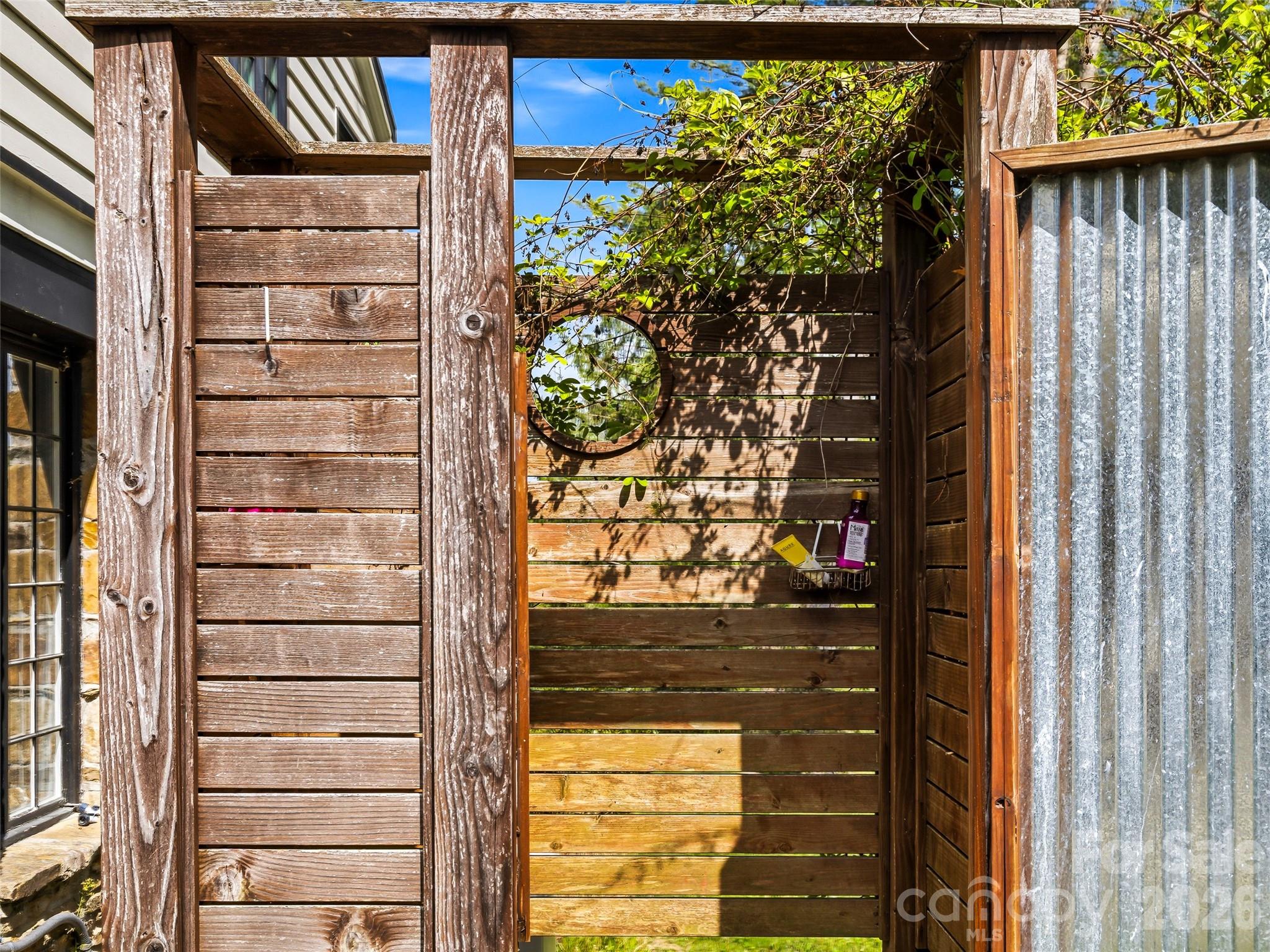 Private outdoor shower conveniently located off the pool, perfect for rinsing off after a swim. - 10 Kalimar Heights, Hendersonville