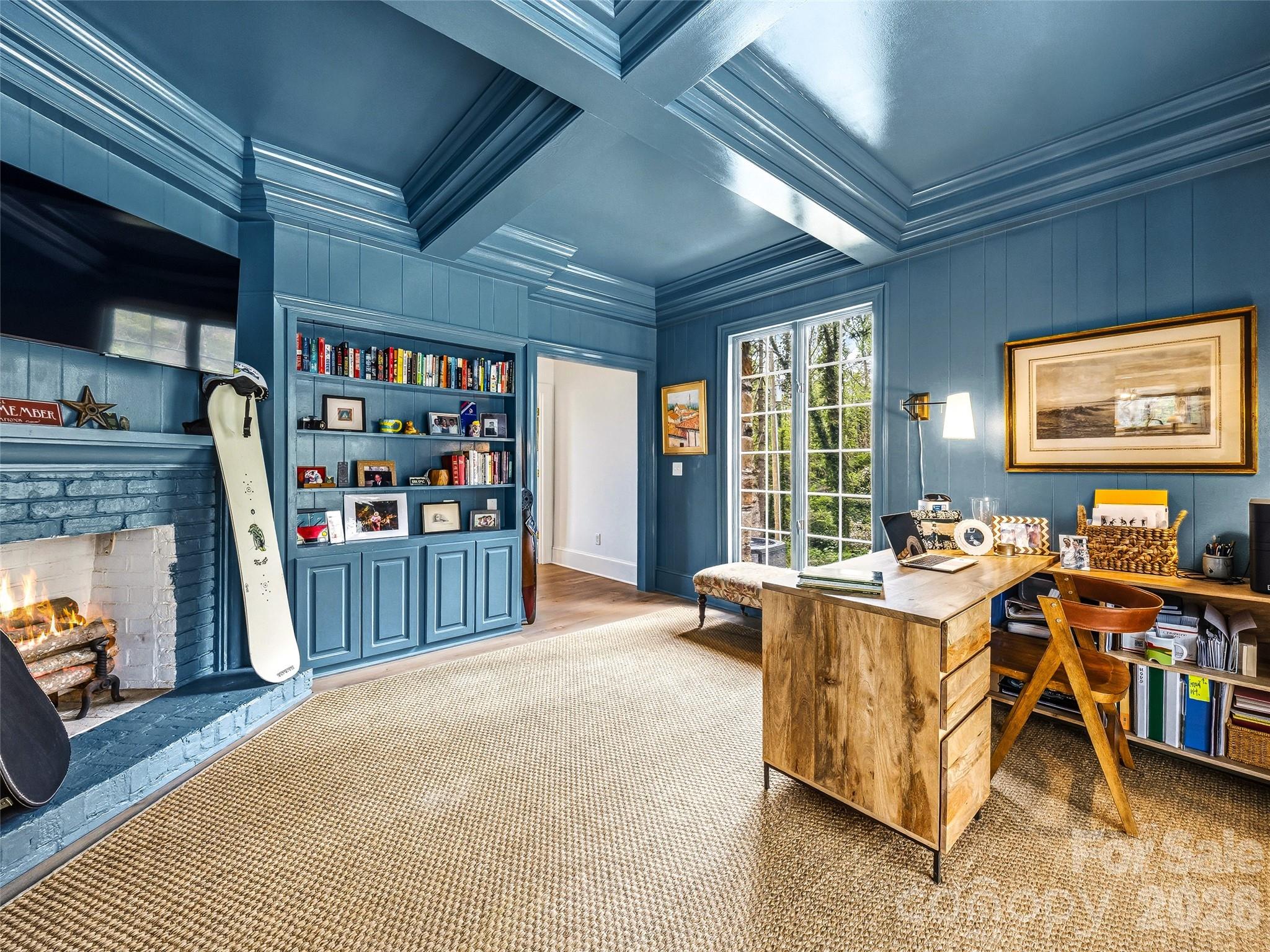 Office on the main floor overlooking the pool with a wood burning fireplace. There is also a private powder bath off of this space. - 10 Kalimar Heights, Hendersonville