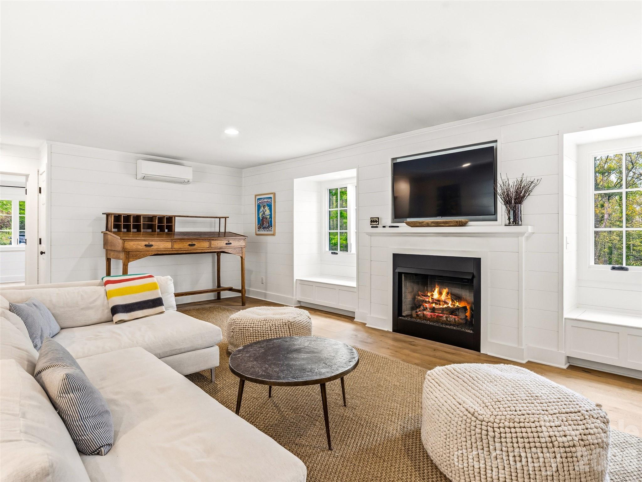 Spacious den in the guest wing with plenty of storage and cozy gas log fireplace. - 10 Kalimar Heights, Hendersonville