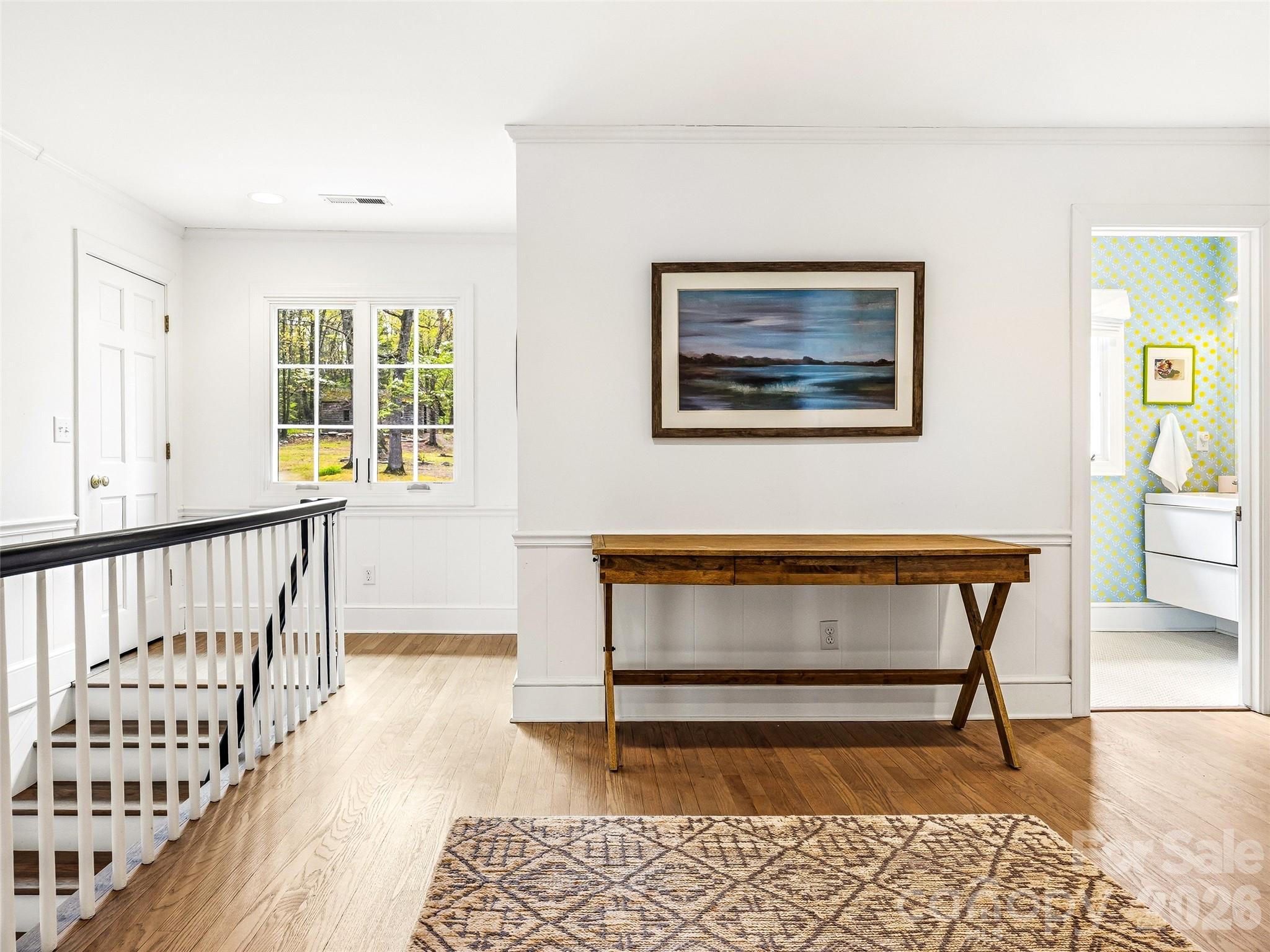 Spacious landing on the second level with access to four bedrooms. All hardwood flooring is original and refinished. - 10 Kalimar Heights, Hendersonville