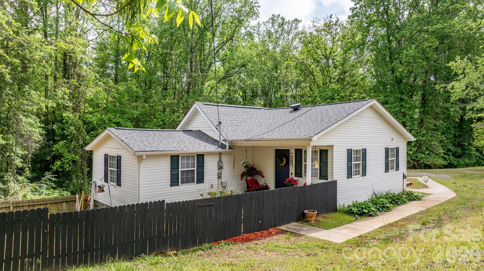This is front door with porch. When you drive up you will see the back door and deck. - 625 Milton Avenue SW, Valdese