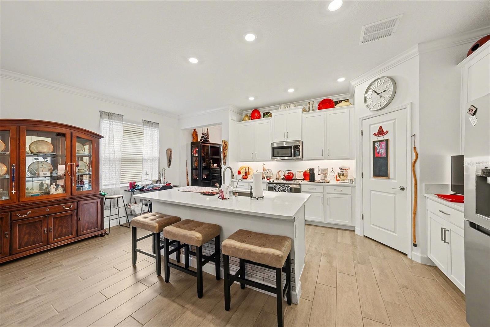 Kitchen view with Island - 10395 BANYAN BREEZE BLVD, LAND O LAKES