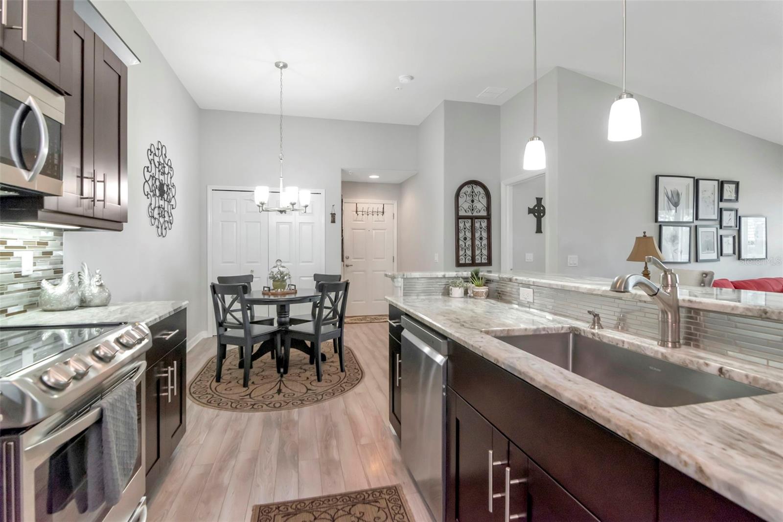 View from your stunning Kitchen to front door - 6395 BANYAN BLVD #303, NEW PORT RICHEY