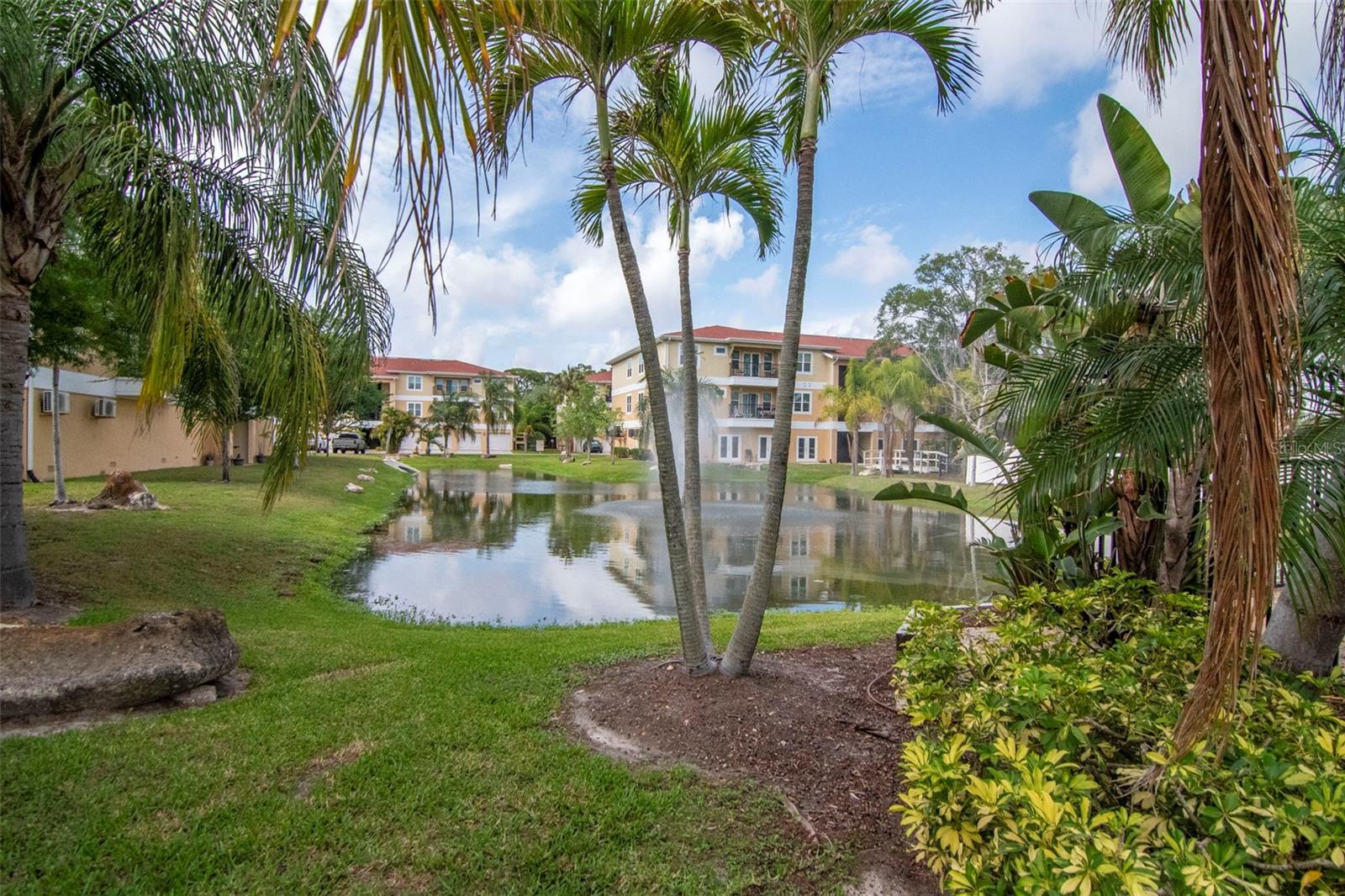 Pond adjacent to the pool and spa. - 6395 BANYAN BLVD #303, NEW PORT RICHEY