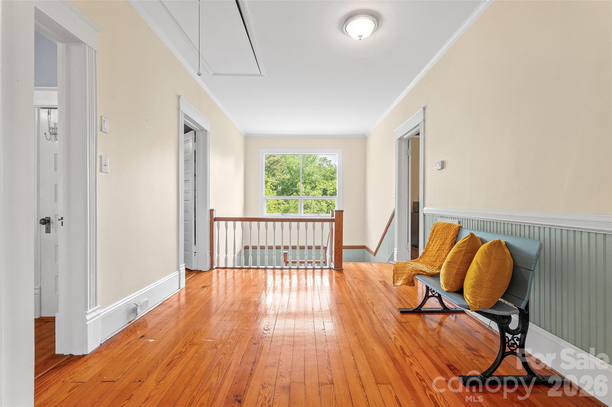Traditional large landing with plent of light at top of the stairs and additional closets. - 602 N Main Street, Davidson