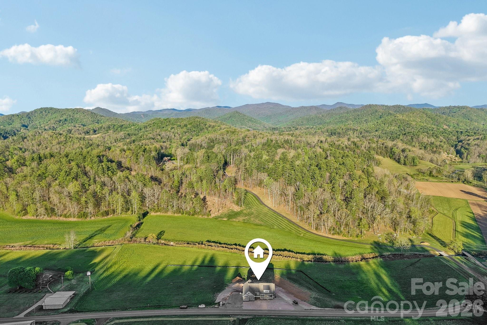 Set in the rolling hills of California Creek sits 1060 Old California Creek Rd. 4 Bed/3 1/2 Bath Home - 1060 California Creek Road, Mars Hill