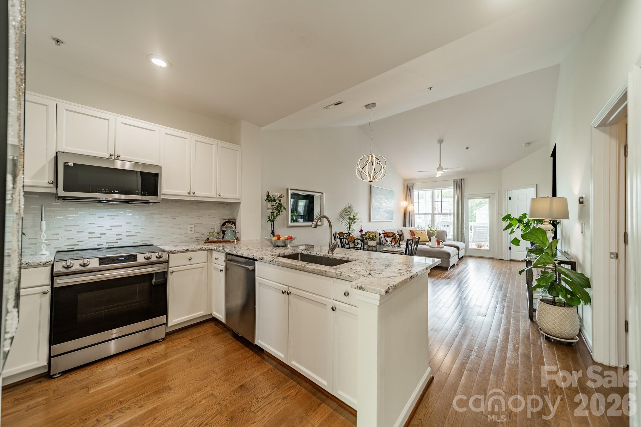 Gorgeous kitchen counter! Almost-new appliance updates. New light fixture and plumbing accents. You will love this kitchen! - 18736 Nautical Drive, Cornelius