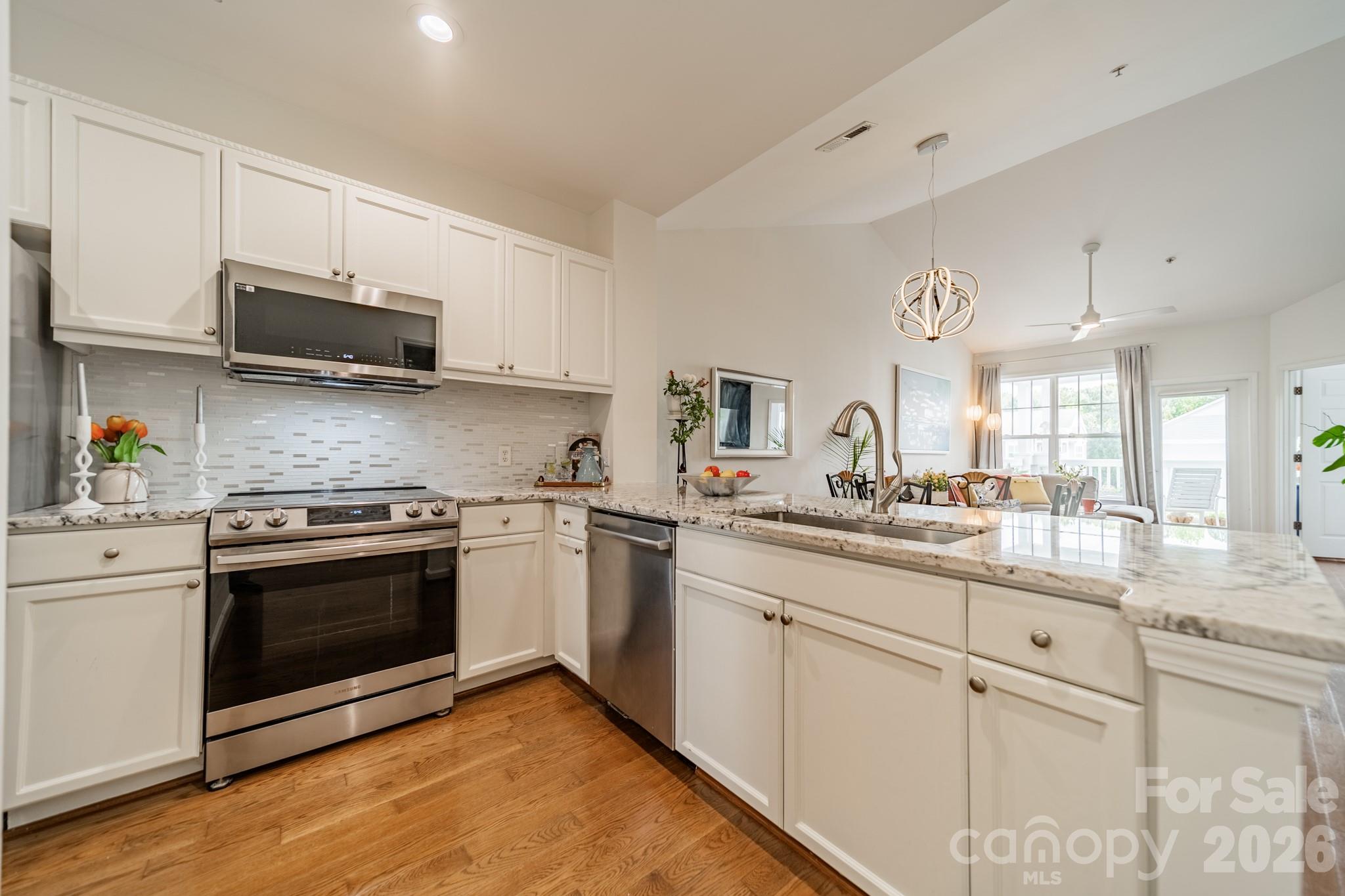 Whether you are cooking or entertaining, being able to look out to the rear view and the open living area will make you glad you are home. - 18736 Nautical Drive, Cornelius