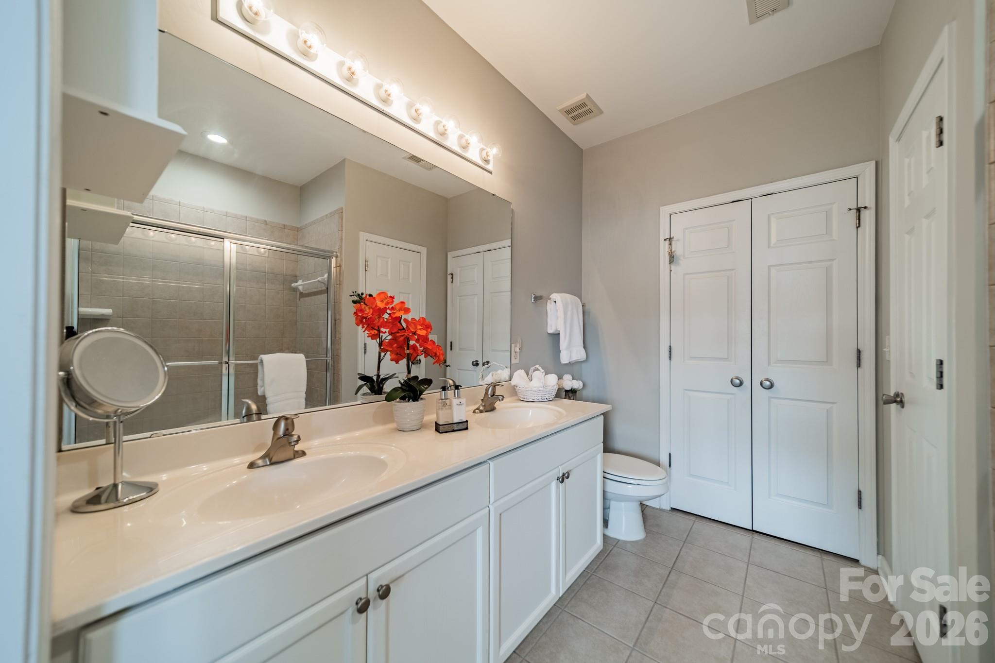 Primary bath has a long, double vanity to keep you organized and comfortable. NOTE - there are two closets. - 18736 Nautical Drive, Cornelius