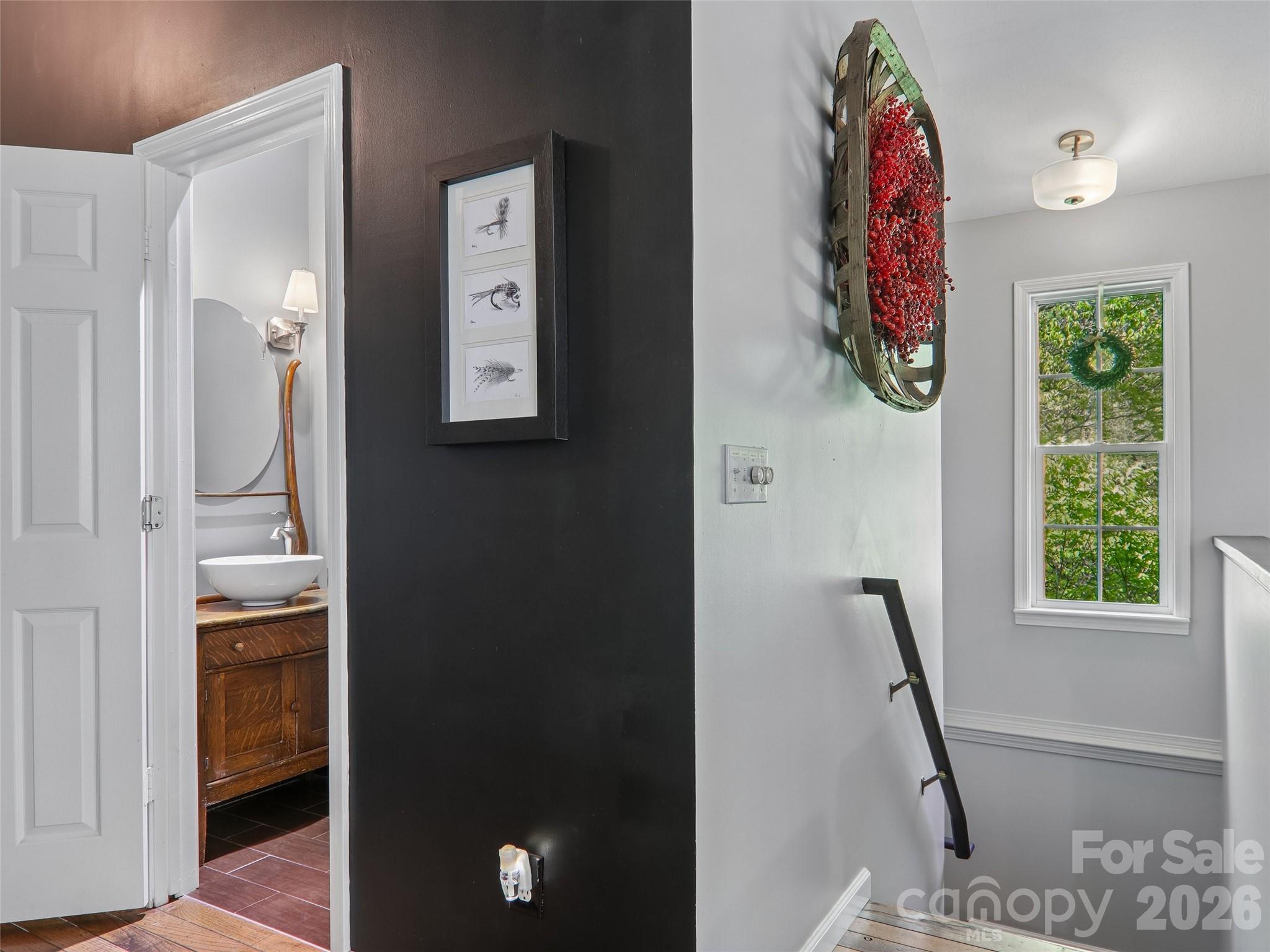 Half bath on main level;stairs lead to basement apartment w/private entrance - 554 Pisgah Forest Drive, Pisgah Forest