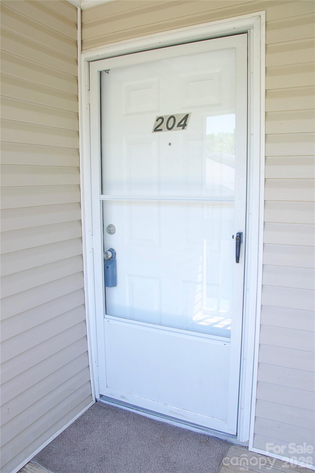 Condo has storm door to let in more natural light - 1610 Eagles Place, Rock Hill