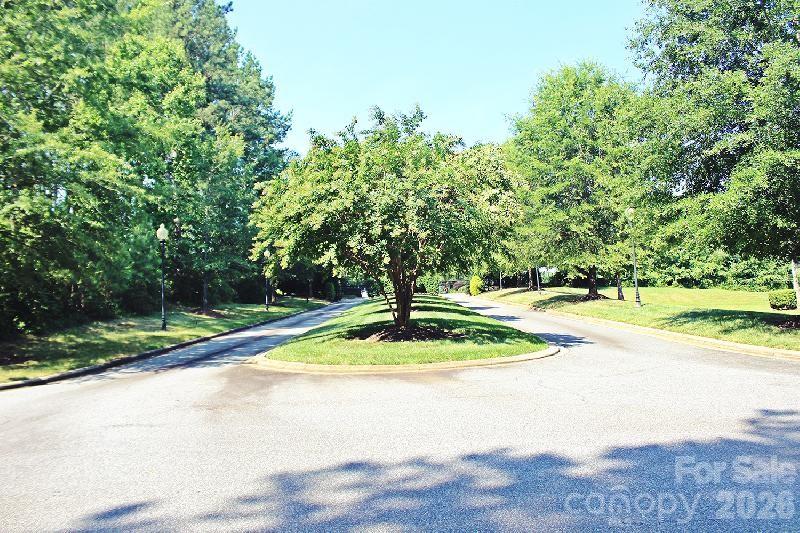 Tree-canopied streets wind through the community - 6020 Plantation Pointe Drive, Granite Falls