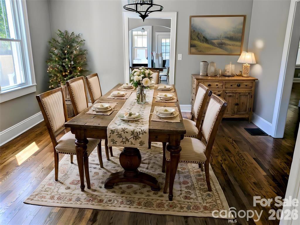 Virtually staged Formal dining room w/new fixture & beautiful wood floors. - 933 W Warren Street, Shelby
