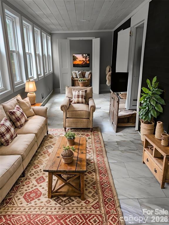 Family room is filled with light from the wall of new Argon wondows. There is direct access from the family room to the basement where you have "at your fingertips" storage. Room virtually stages. - 933 W Warren Street, Shelby