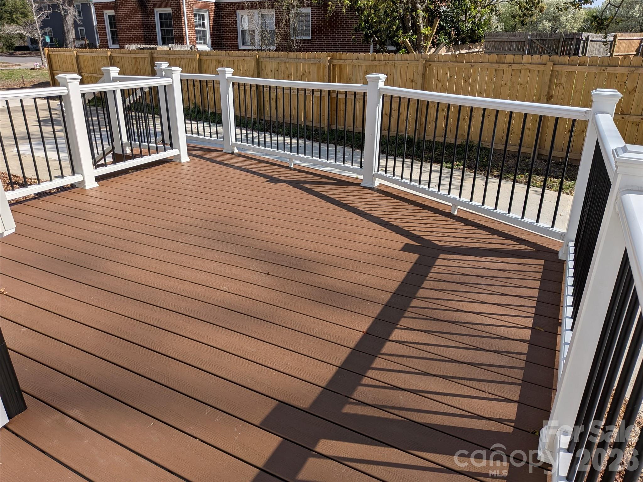 Awesome back deck for relaxing or entertaining. Overlooks large concrete area.Awesome for extra parking space,but could have so many other uses. - 933 W Warren Street, Shelby