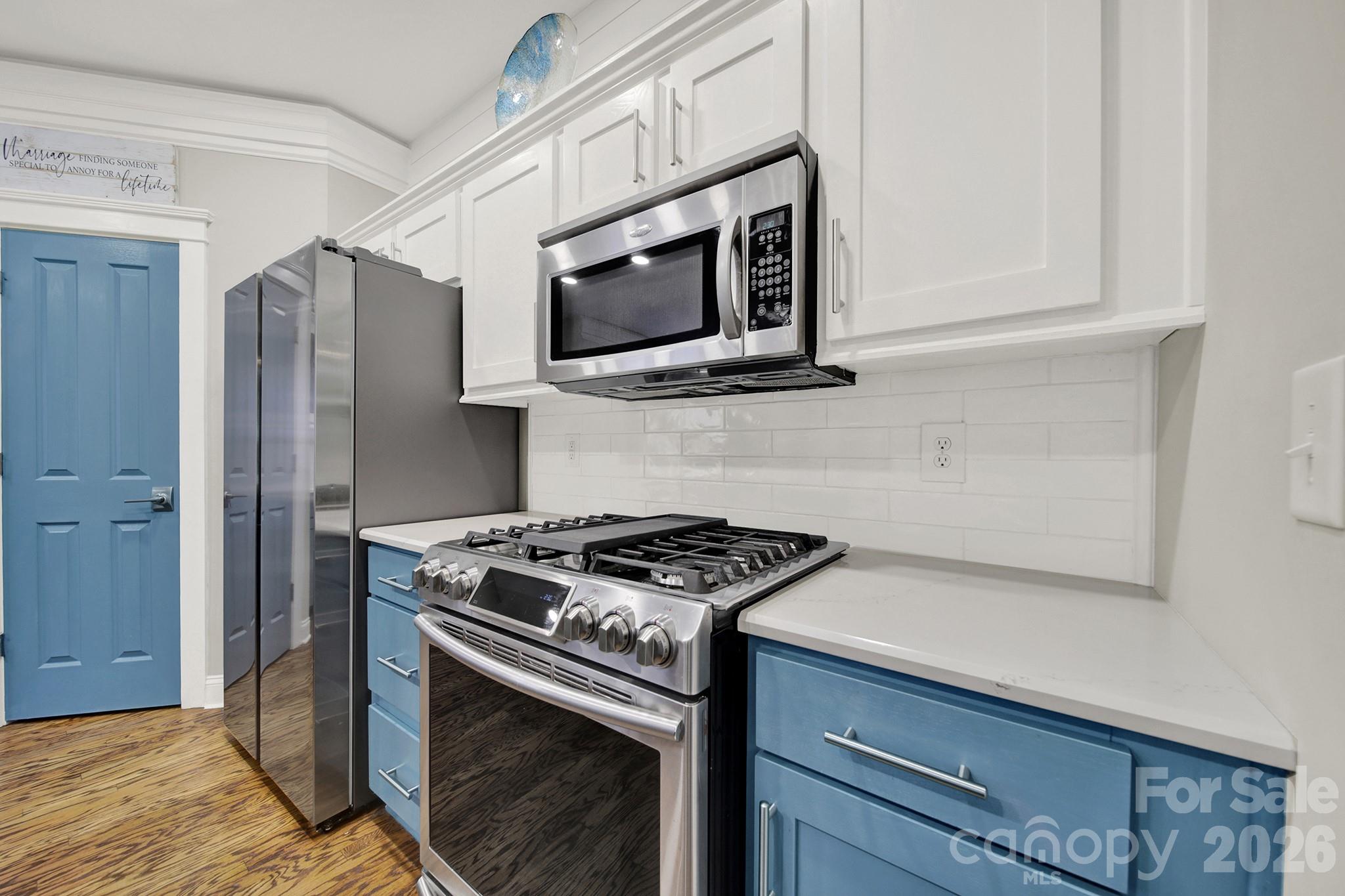 Kitchen with Quartz Countertops and Subway Backsplash - 4214 Settler Heights Drive, Fort Mill