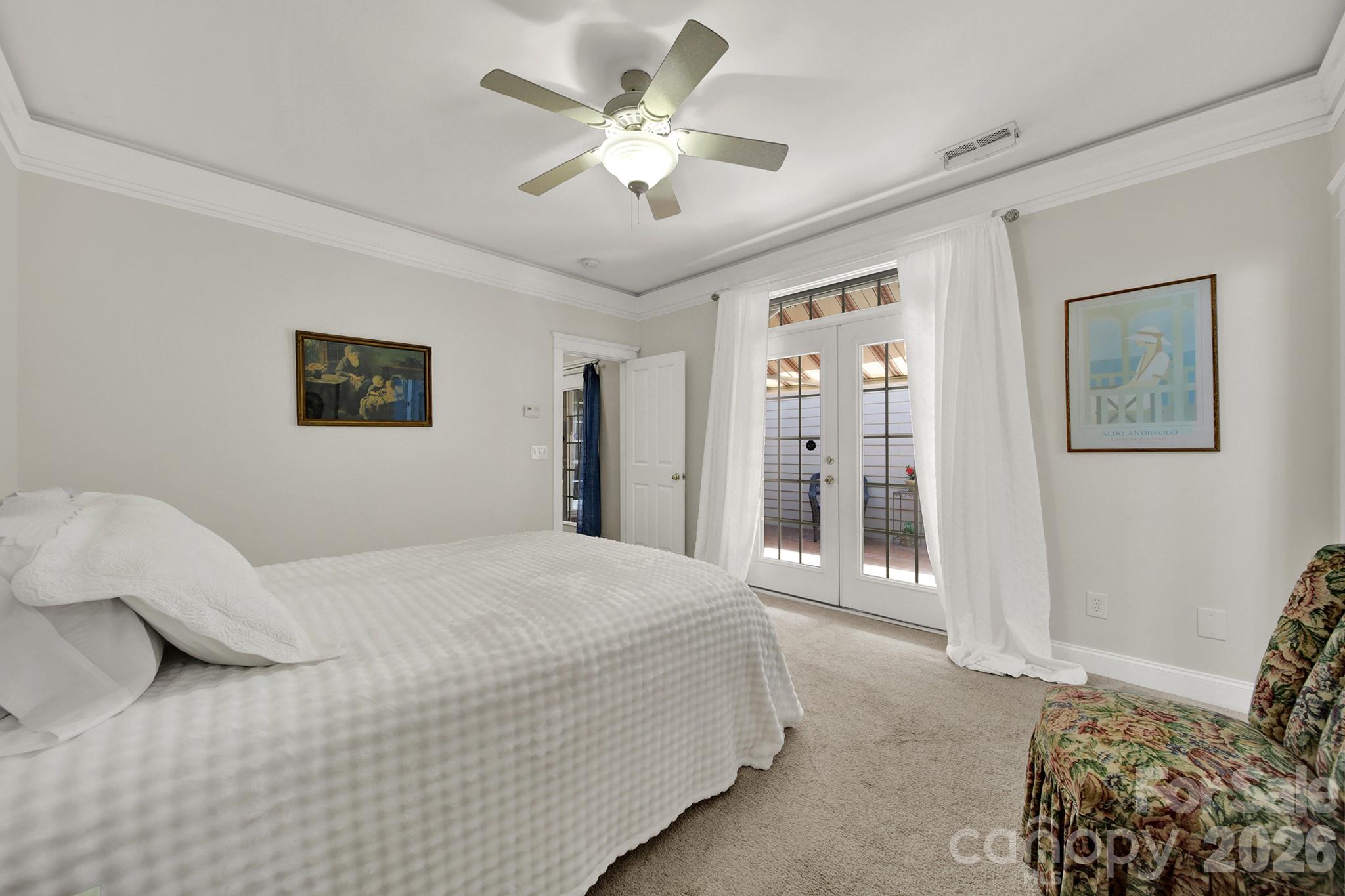 Primary Bedroom with French Doors leading to Patio - 4214 Settler Heights Drive, Fort Mill