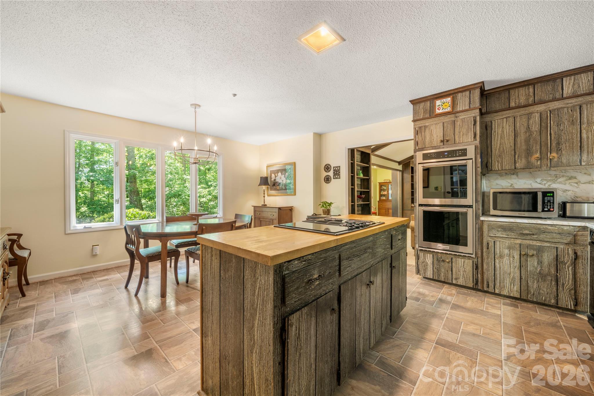 Kitchen w/ island and breakfast nook - 3426 Driftwood Drive, Gastonia