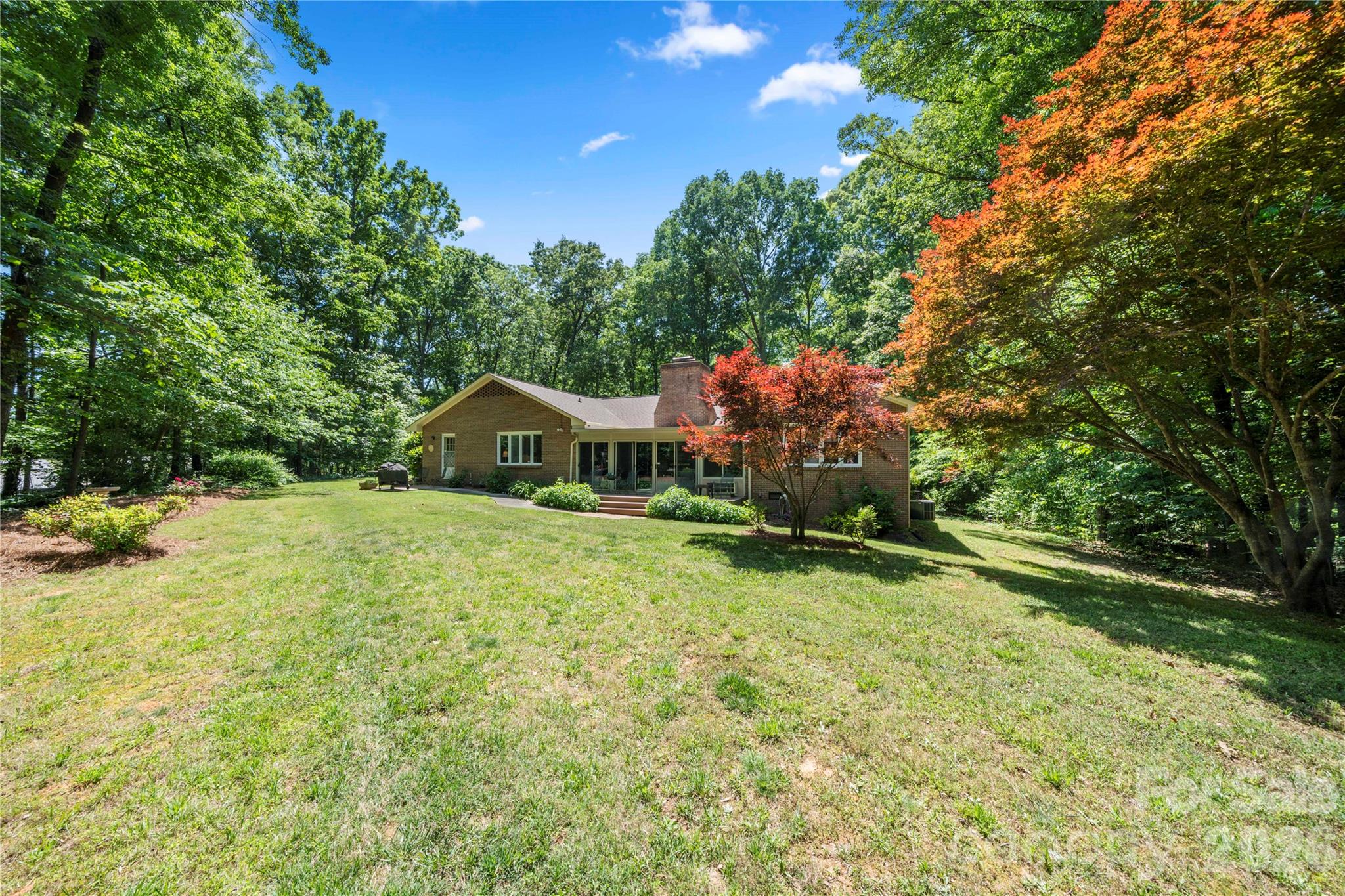 Large mature yard with landscaping and plenty of room to make it your own - 3426 Driftwood Drive, Gastonia