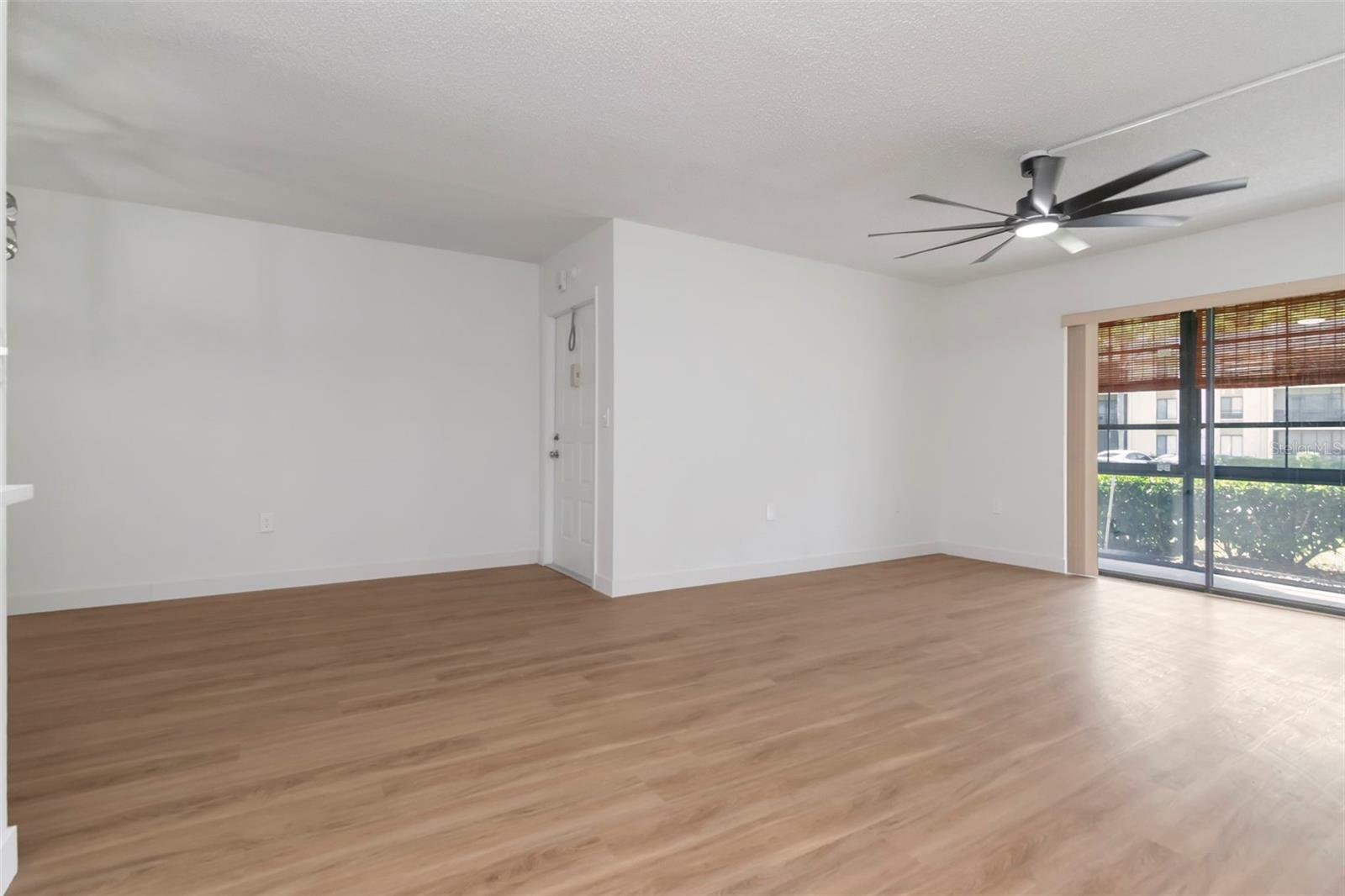 Bright Living Area with Front Patio Access - 3211 LAKE PINE WAY E #A1, TARPON SPRINGS