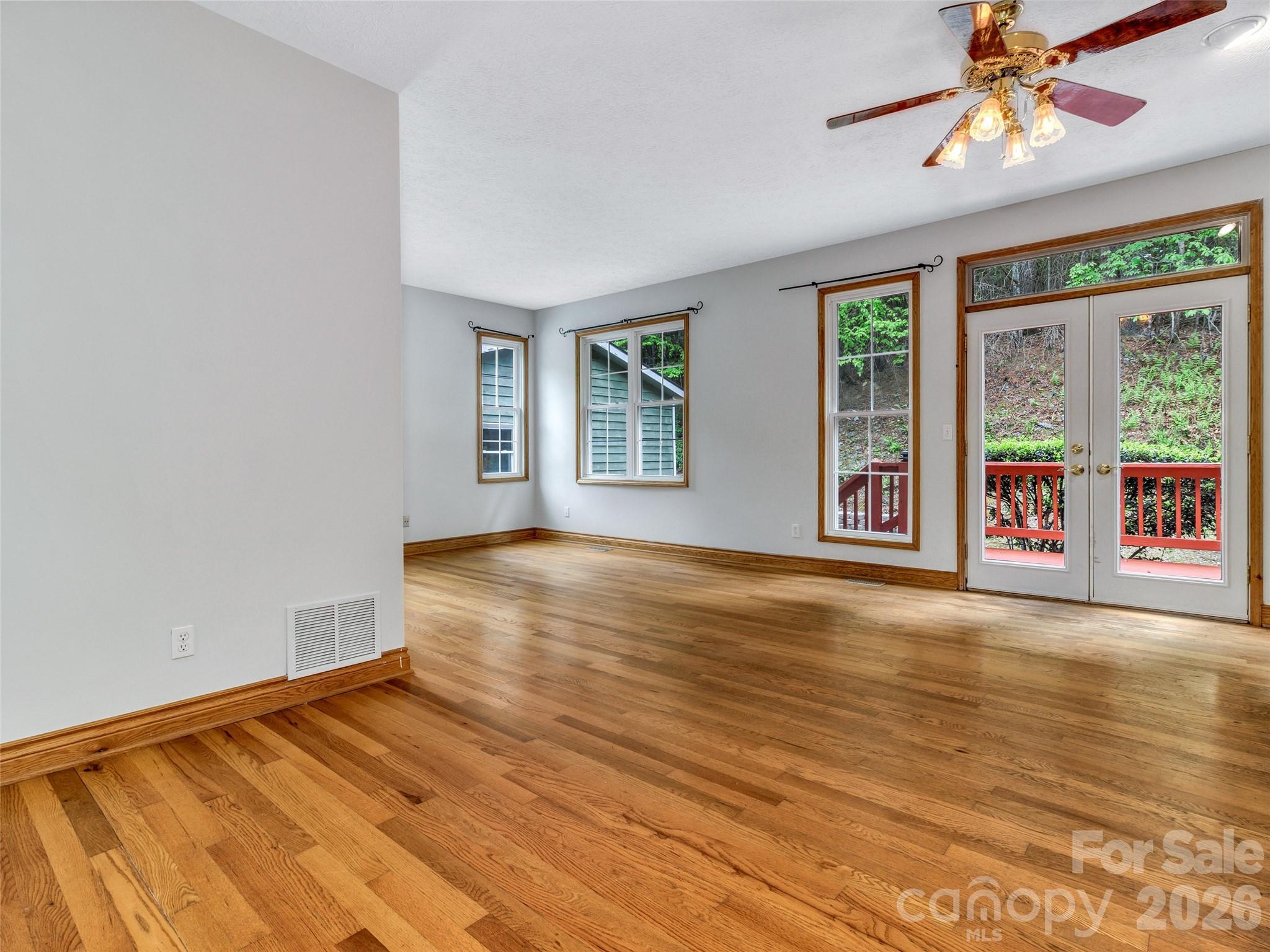 Primary bedroom that has it's own access to the back deck. - 287 Shady Creek Lane, Hendersonville