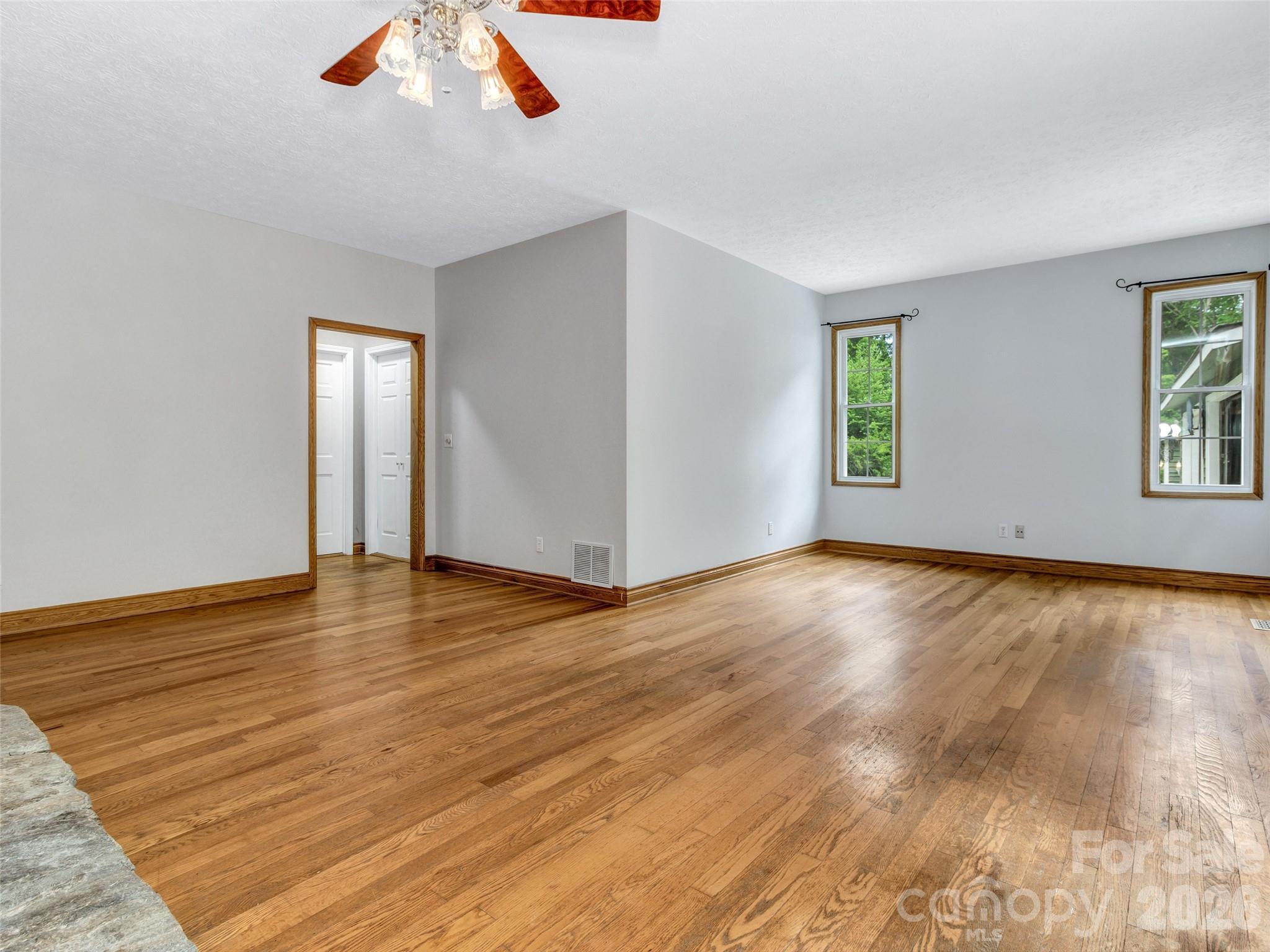 Primary bedroom with large his and her closets and on suite bathroom. - 287 Shady Creek Lane, Hendersonville