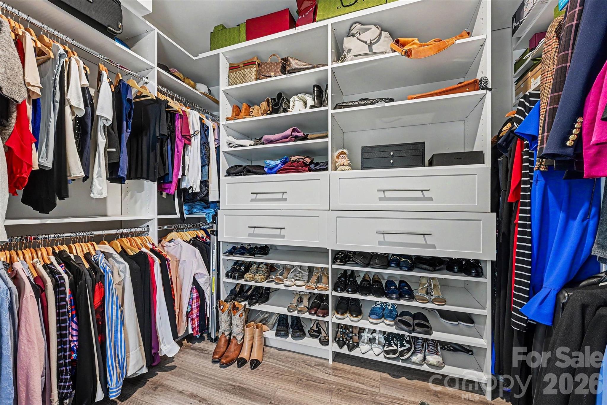 Larger of the 2 primary closets with closet system - 122 Boatwright Lane, Mooresville