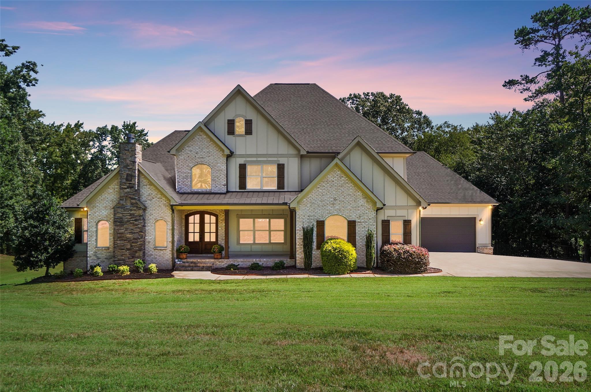 Front exterior at dusk - 3612 Lake Twitty Drive, Monroe