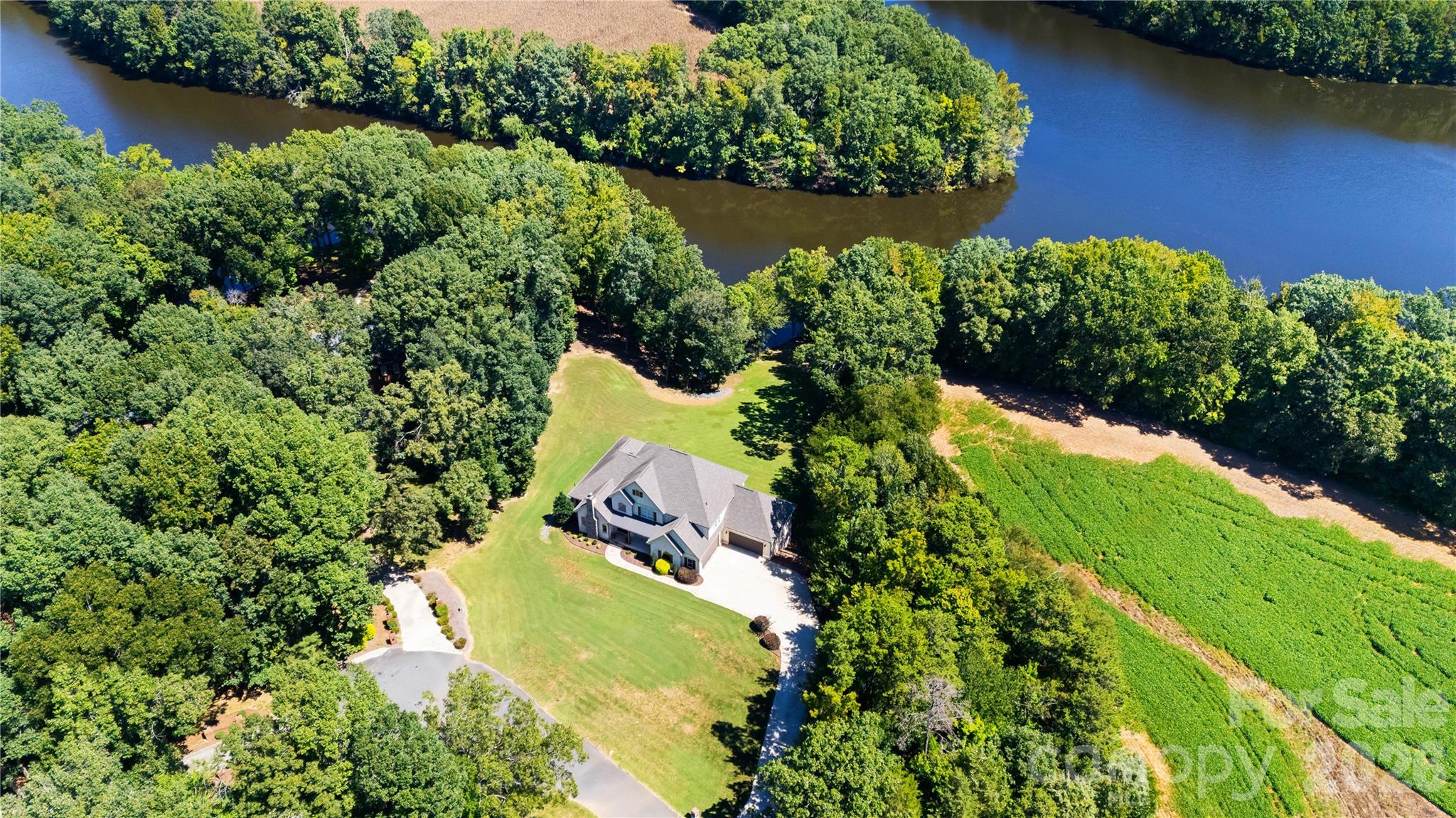 Aerial view of the home with Lake Twitty behind the home. - 3612 Lake Twitty Drive, Monroe
