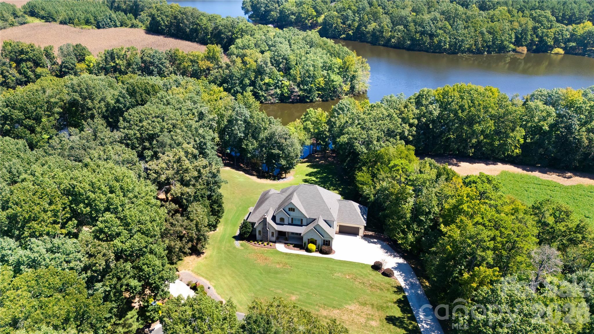 Aerial view of the wooded lot and lake - 3612 Lake Twitty Drive, Monroe