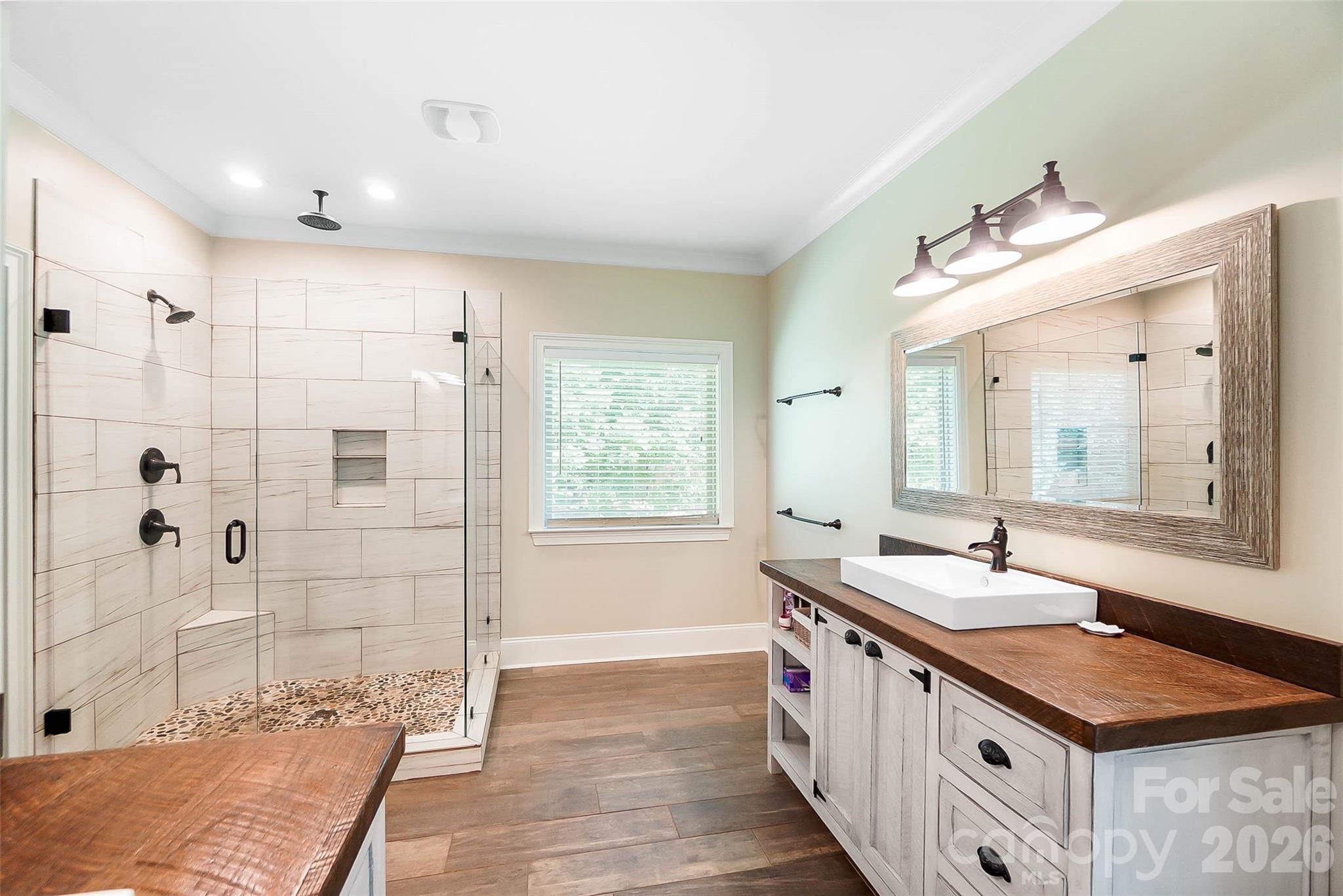 Primary bathroom with shower and dual vanities - 3612 Lake Twitty Drive, Monroe