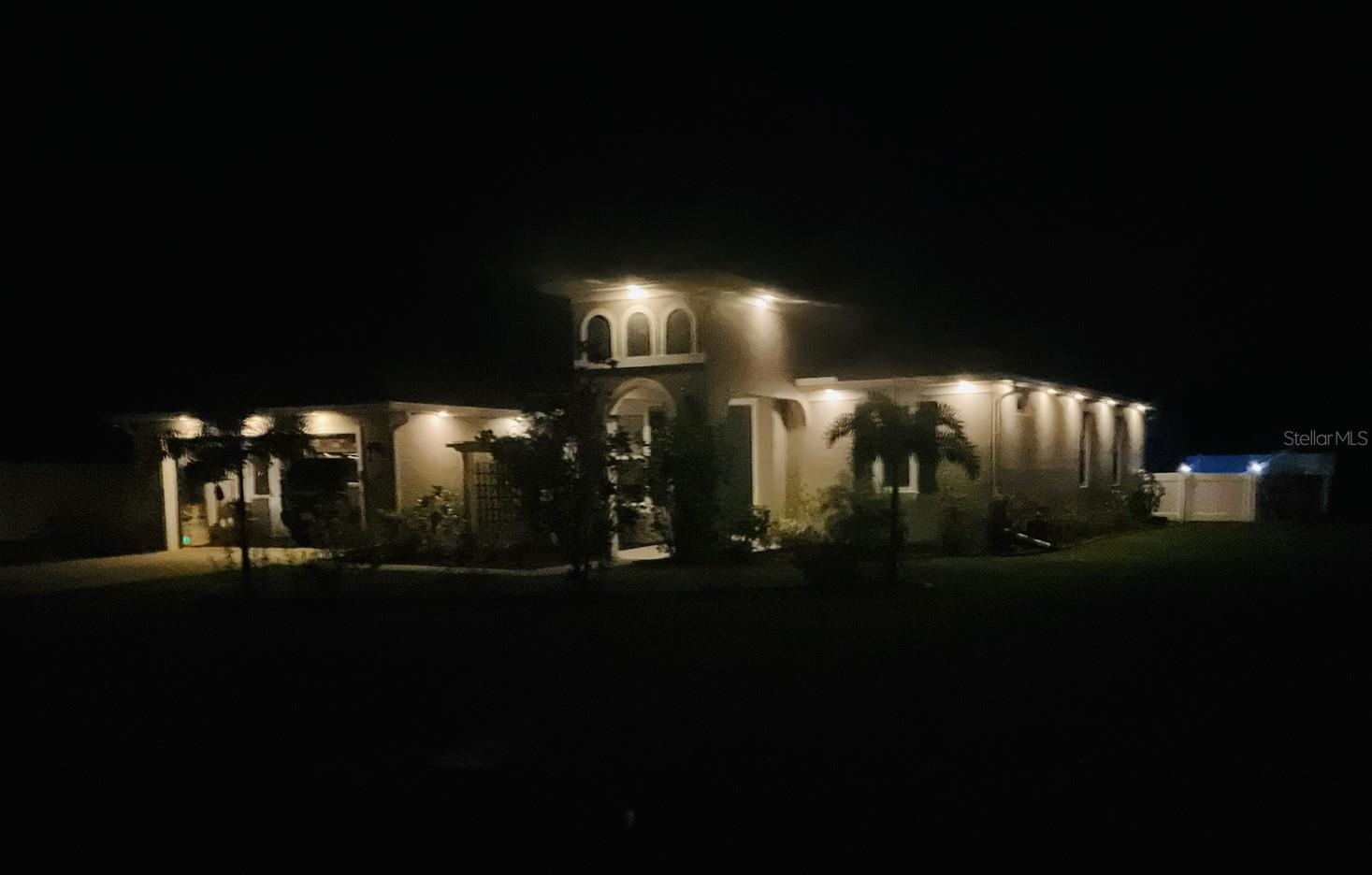 Home has added outdoor lighting - 14 SEVILLE PL, PALM COAST