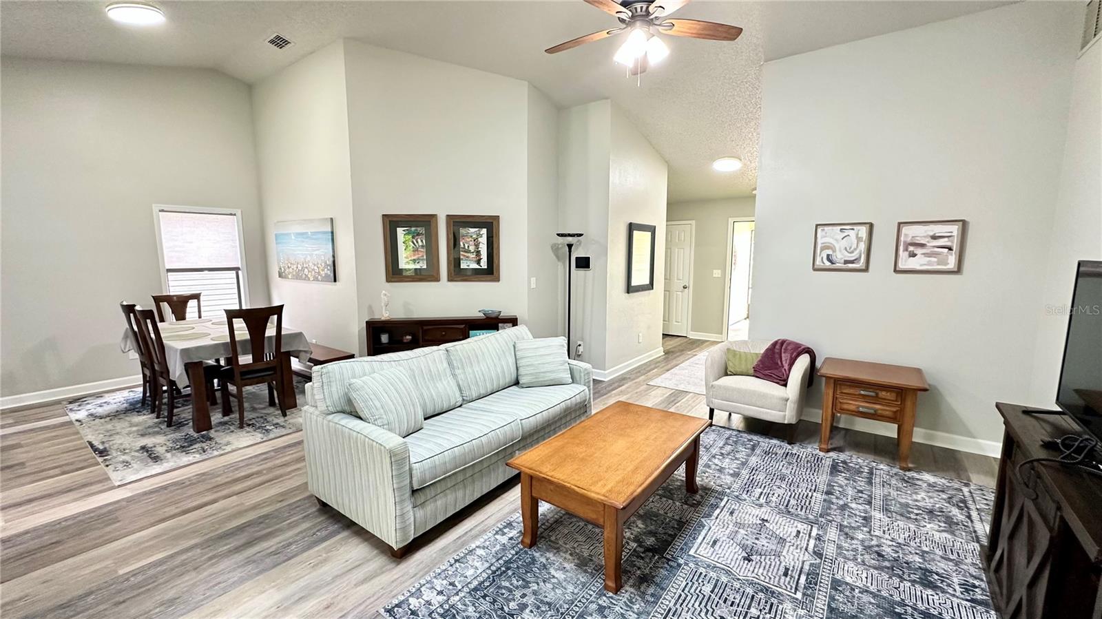 main living view from Florida room toward front door - 782 PINE SHORES CIR, NEW SMYRNA BEACH