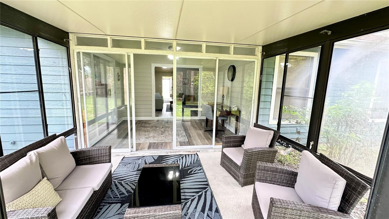 back screened porch view toward Florida room - 782 PINE SHORES CIR, NEW SMYRNA BEACH