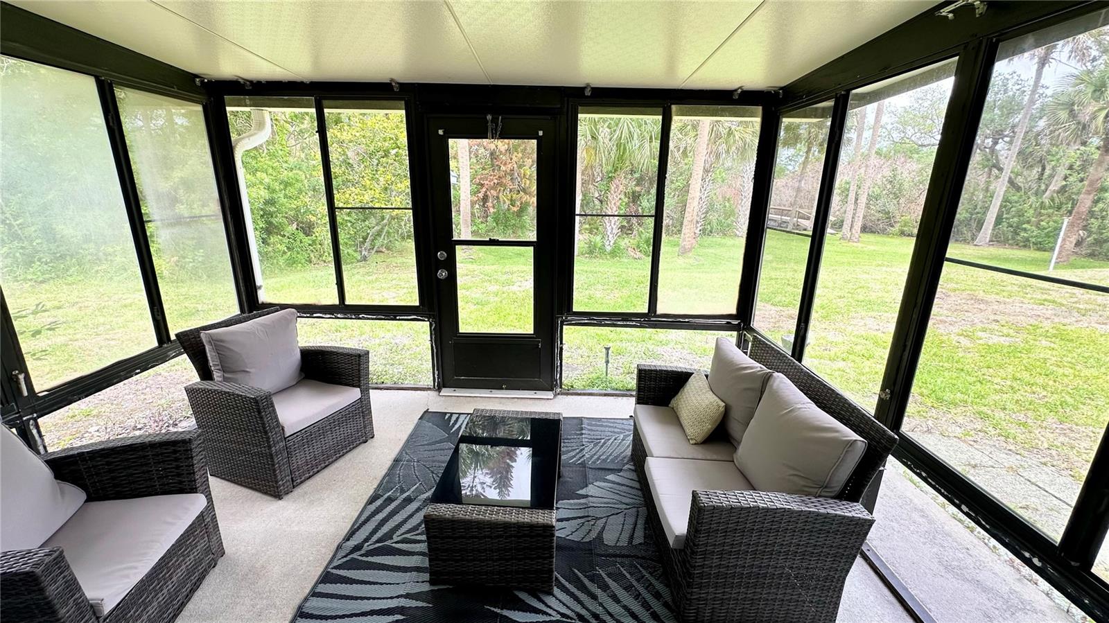 back screened porch view to yard - 782 PINE SHORES CIR, NEW SMYRNA BEACH