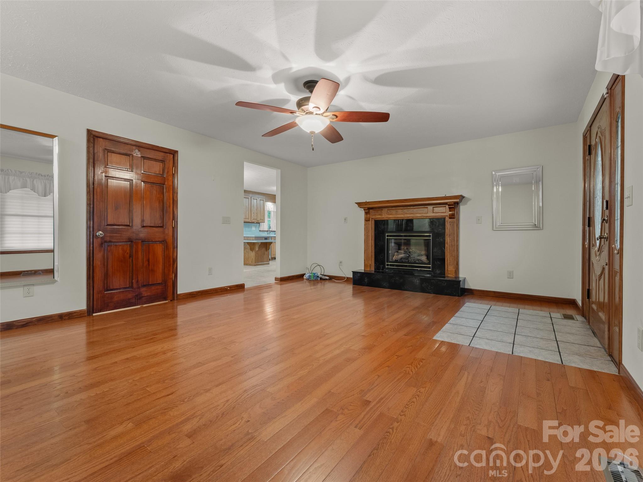 Living Room w/ Fireplace - 476 Jackson Loop Road, Flat Rock