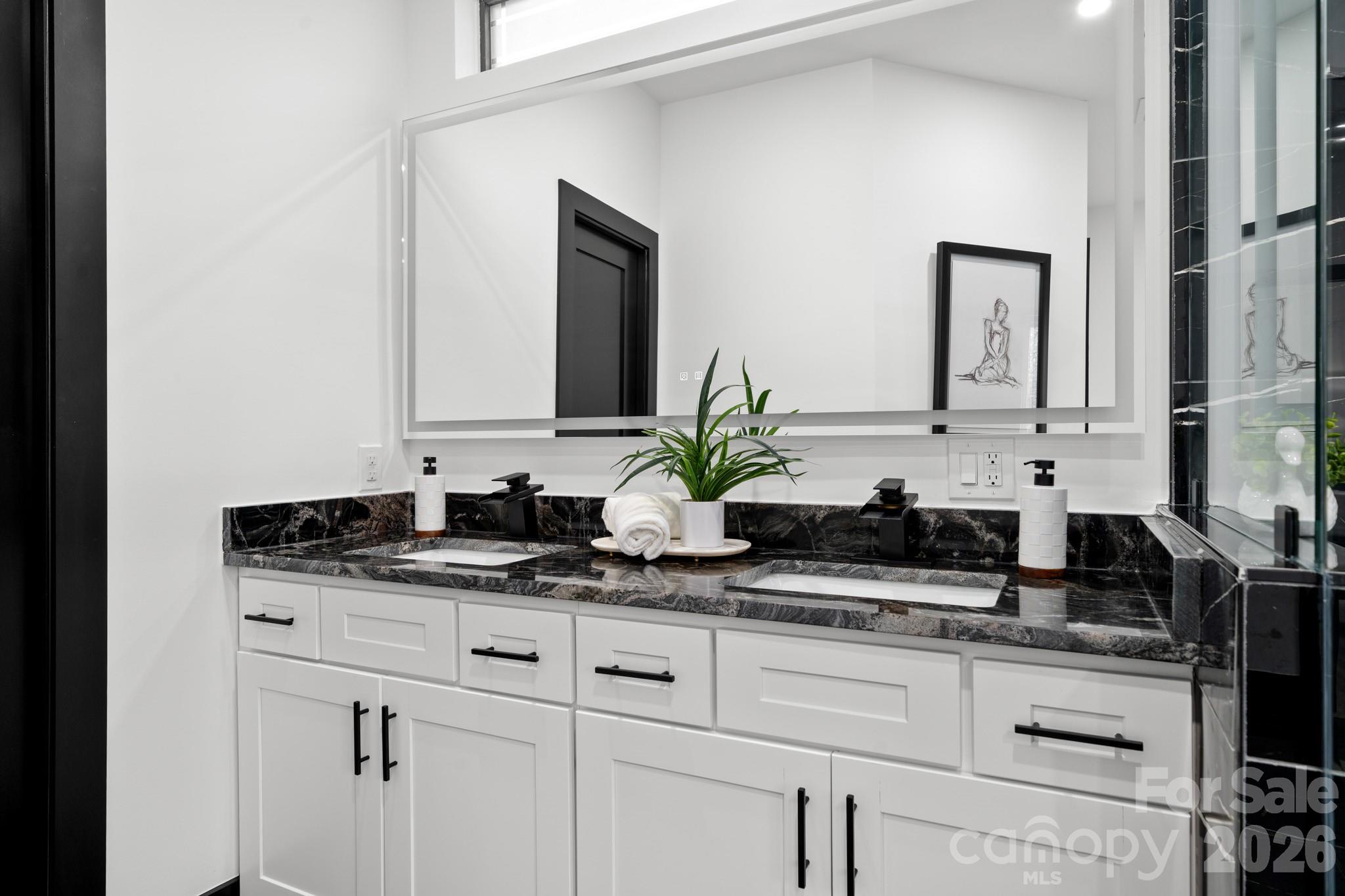Dual vanity primary bathroom, backlit mirror - 74 Jeranna Road, Mills River