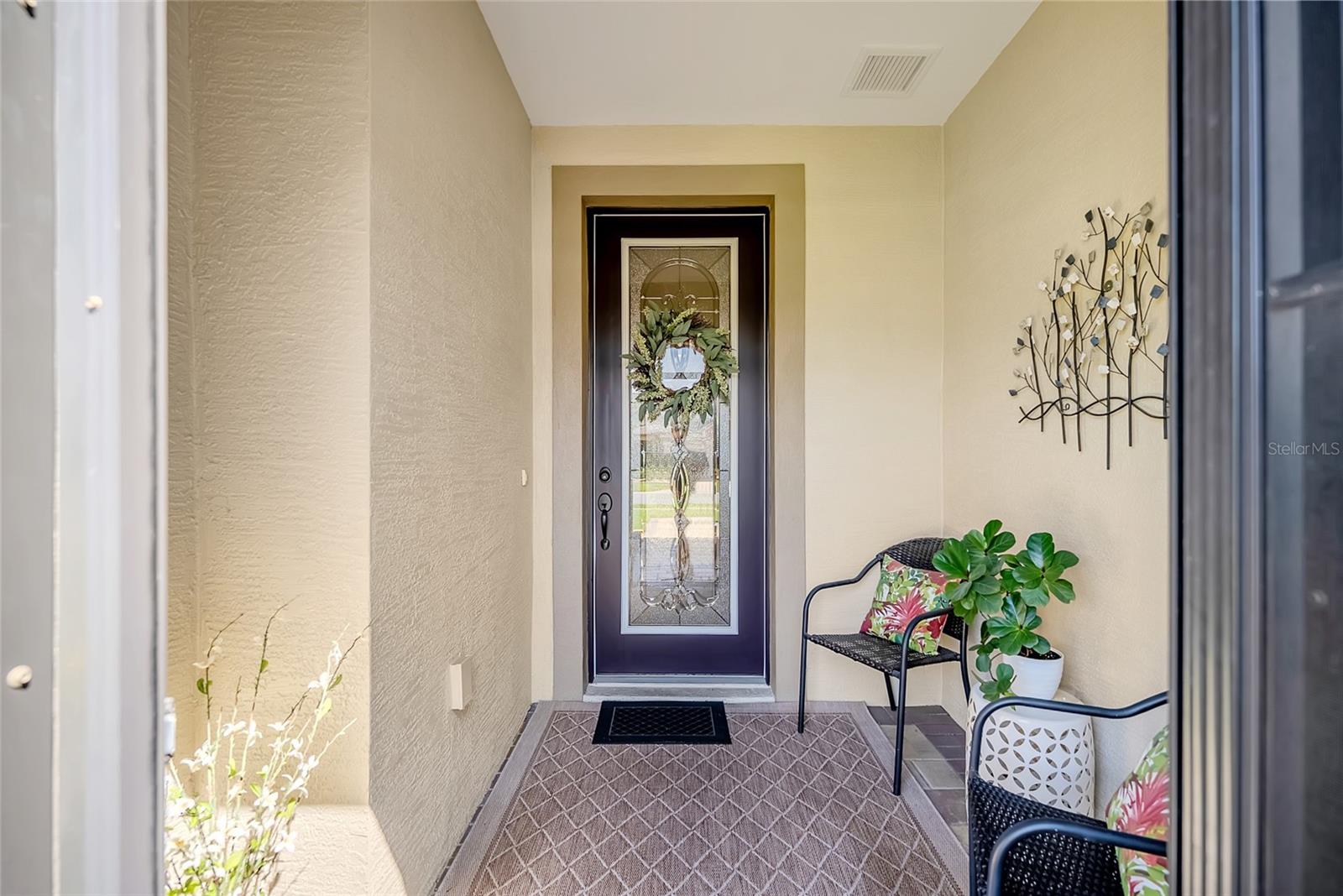 Elegant entry with lead glass door. - 6707 SW 95TH CIR, OCALA