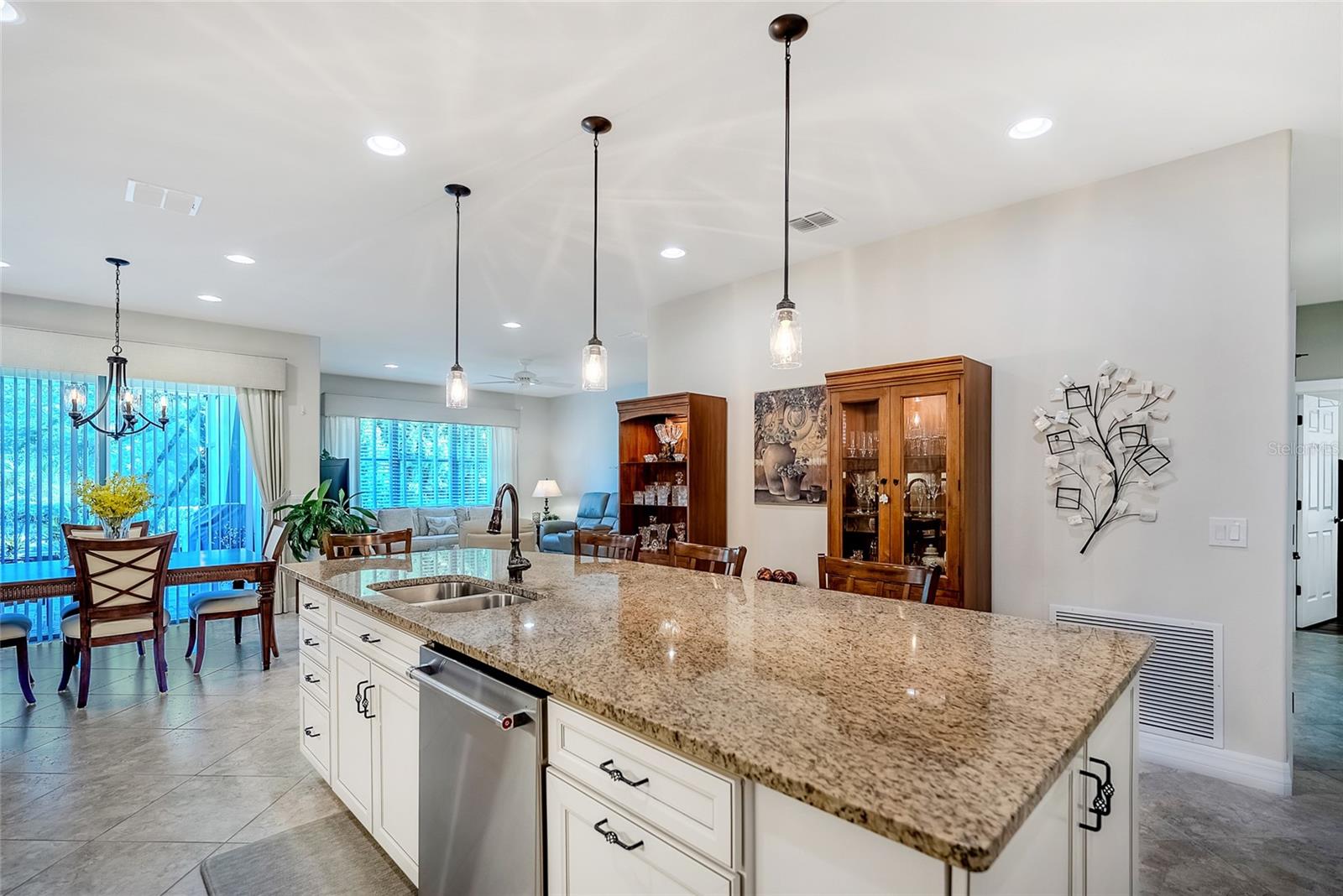 Large granite kitchen counter with plenty of room for stools. - 6707 SW 95TH CIR, OCALA