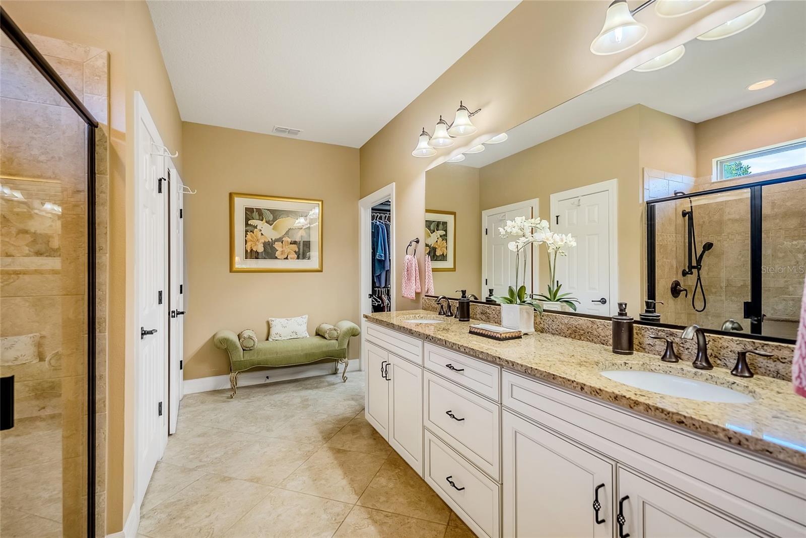 Primary bathroom with duel sinks, solid counter top. - 6707 SW 95TH CIR, OCALA