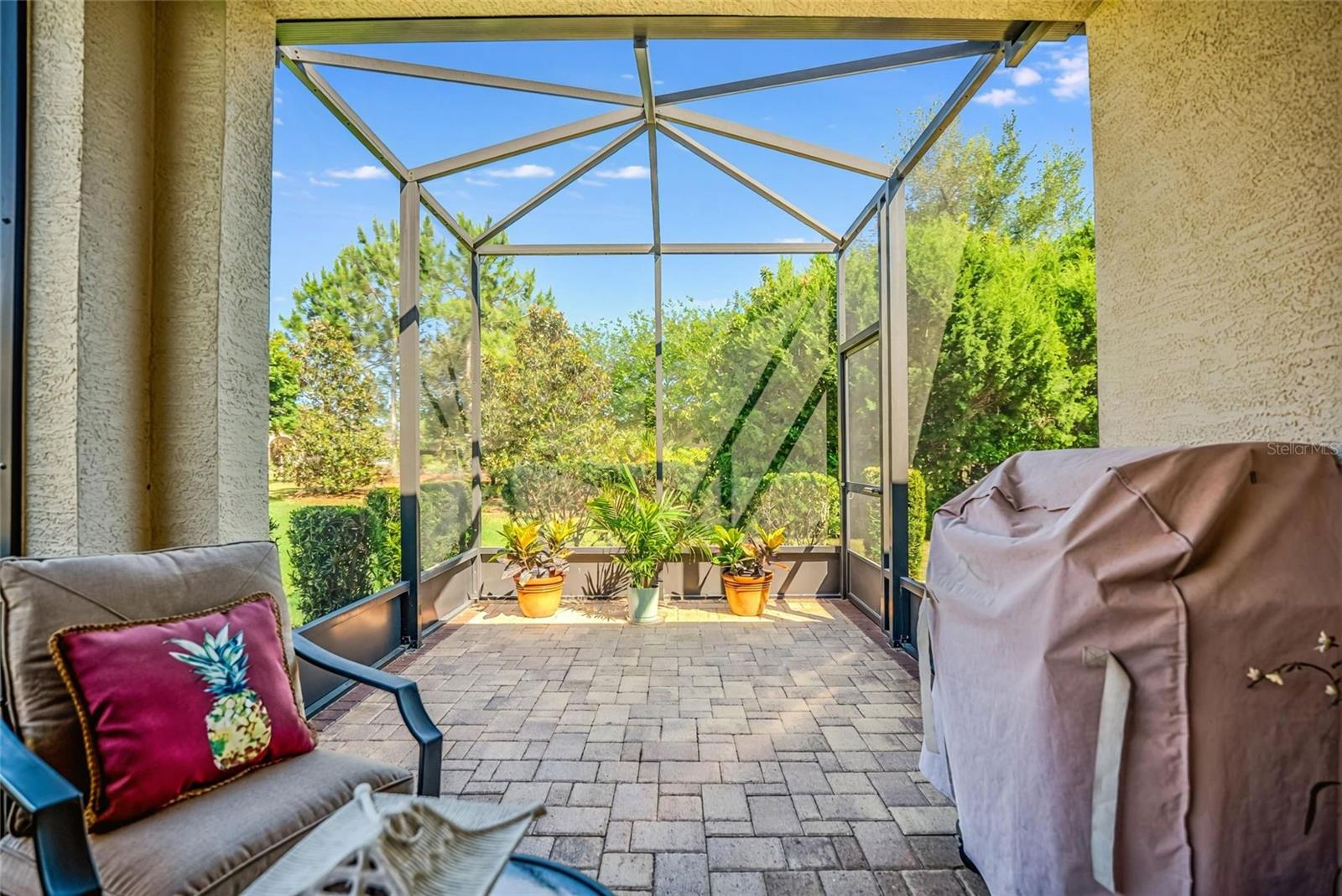 Outside lanai with paver and extended screened area. - 6707 SW 95TH CIR, OCALA