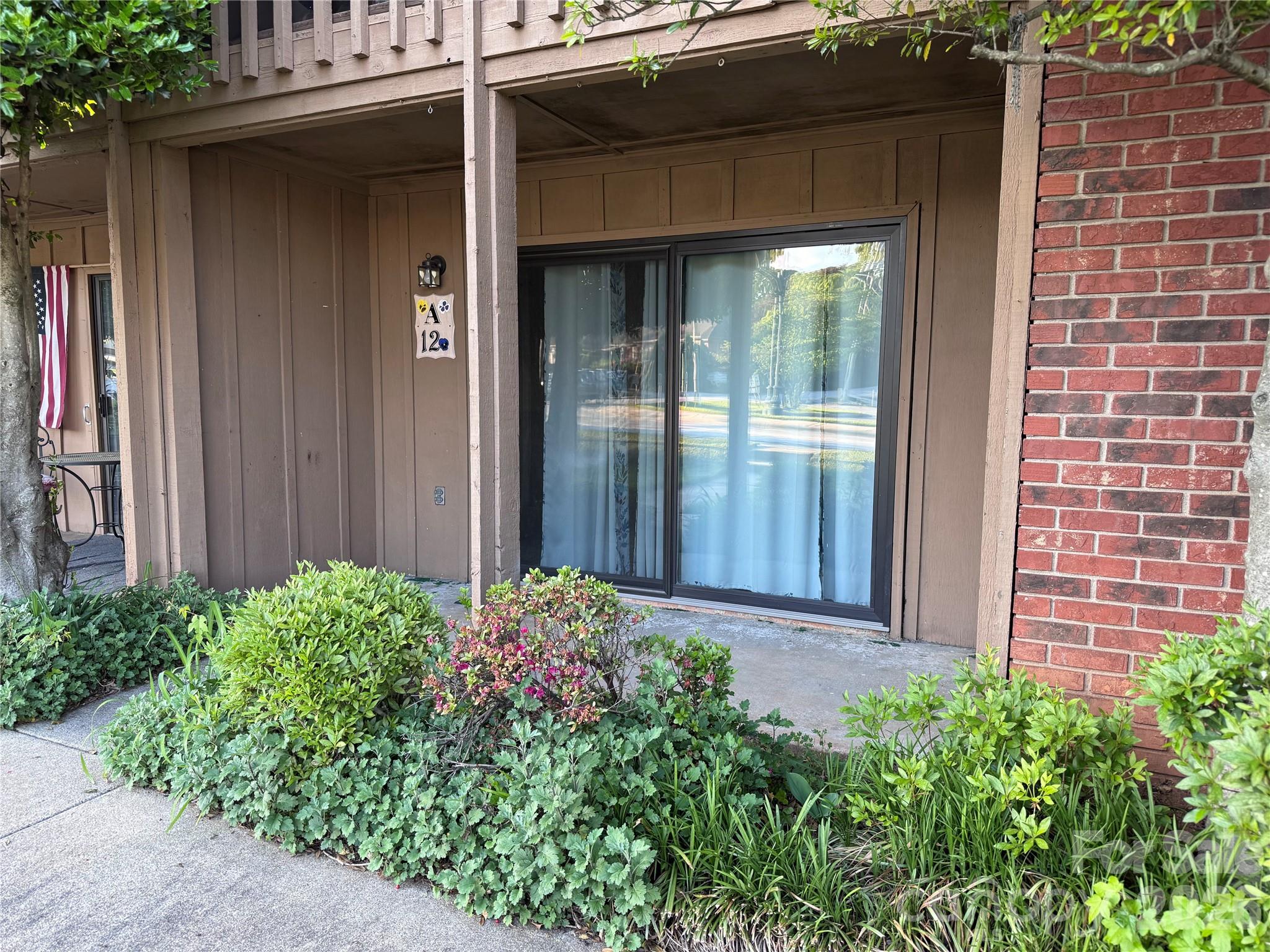 Newer sliding door provides extra soundproofing and insulation. - 427 6th Avenue W, Hendersonville